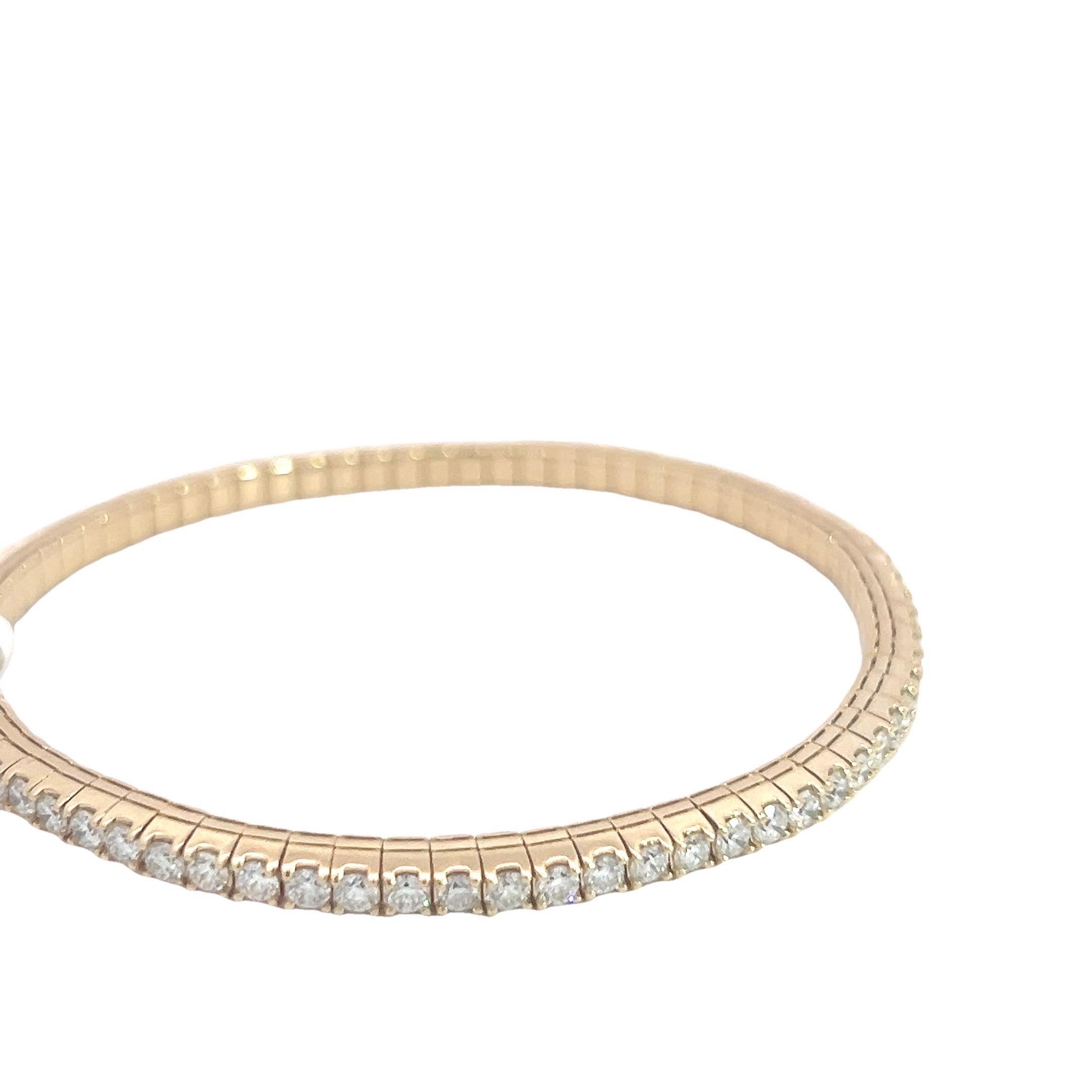 Flexible Tennis Bangle Bracelet in 14k Yellow Gold With Natural Diamonds
This stunning tennis bracelet features a continuous row of natural diamonds, meticulously set in 14k yellow gold. The bracelet's design is flexible, allowing it to gracefully
