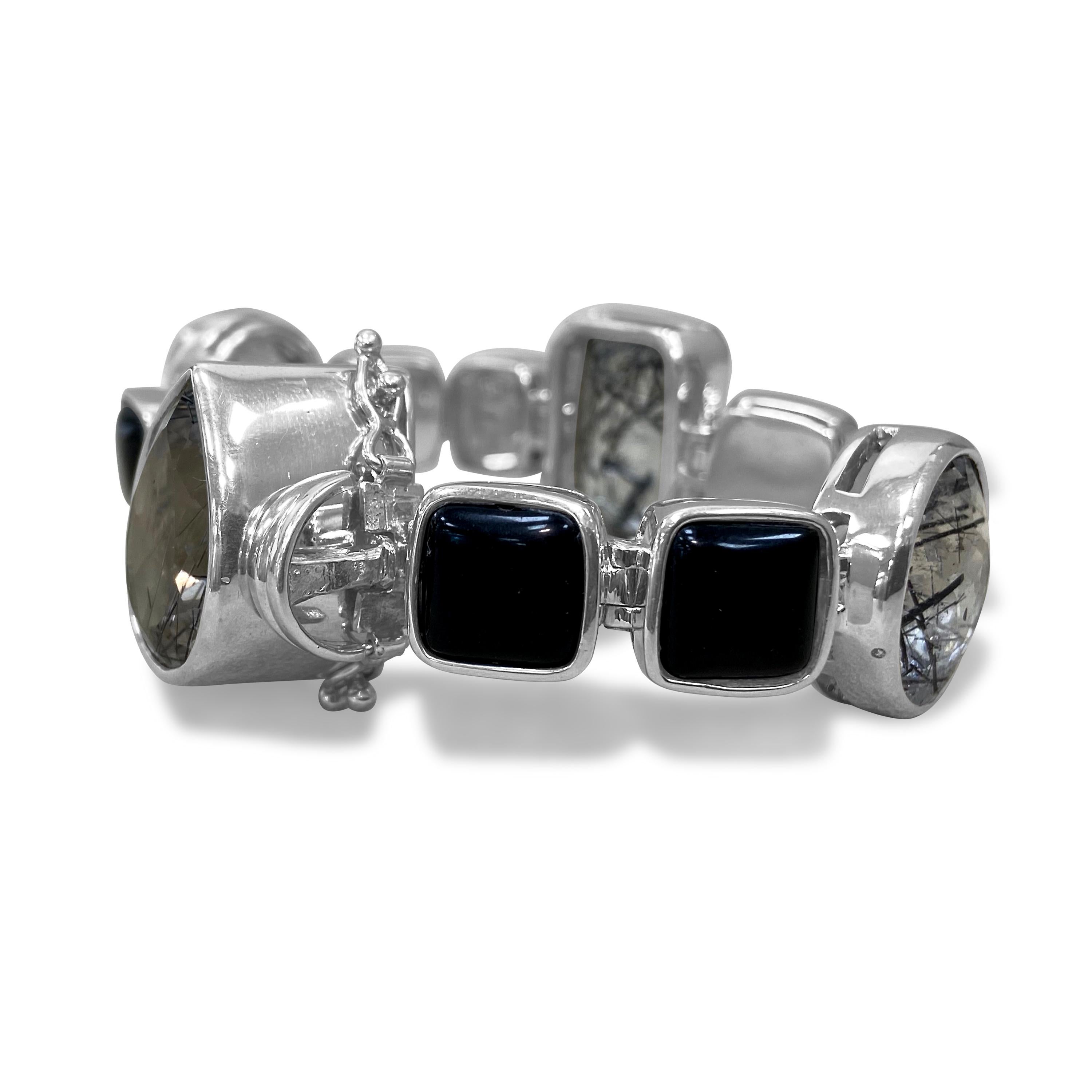 One of a Kind

This gorgeous Tourmalated Quartz & Black Onyx Bracelet is a staple for every look in your wardrobe. Its allure and grandeur make it truly stick out; its unique and shimmering stones help contribute to a truly fashionable & bold look.