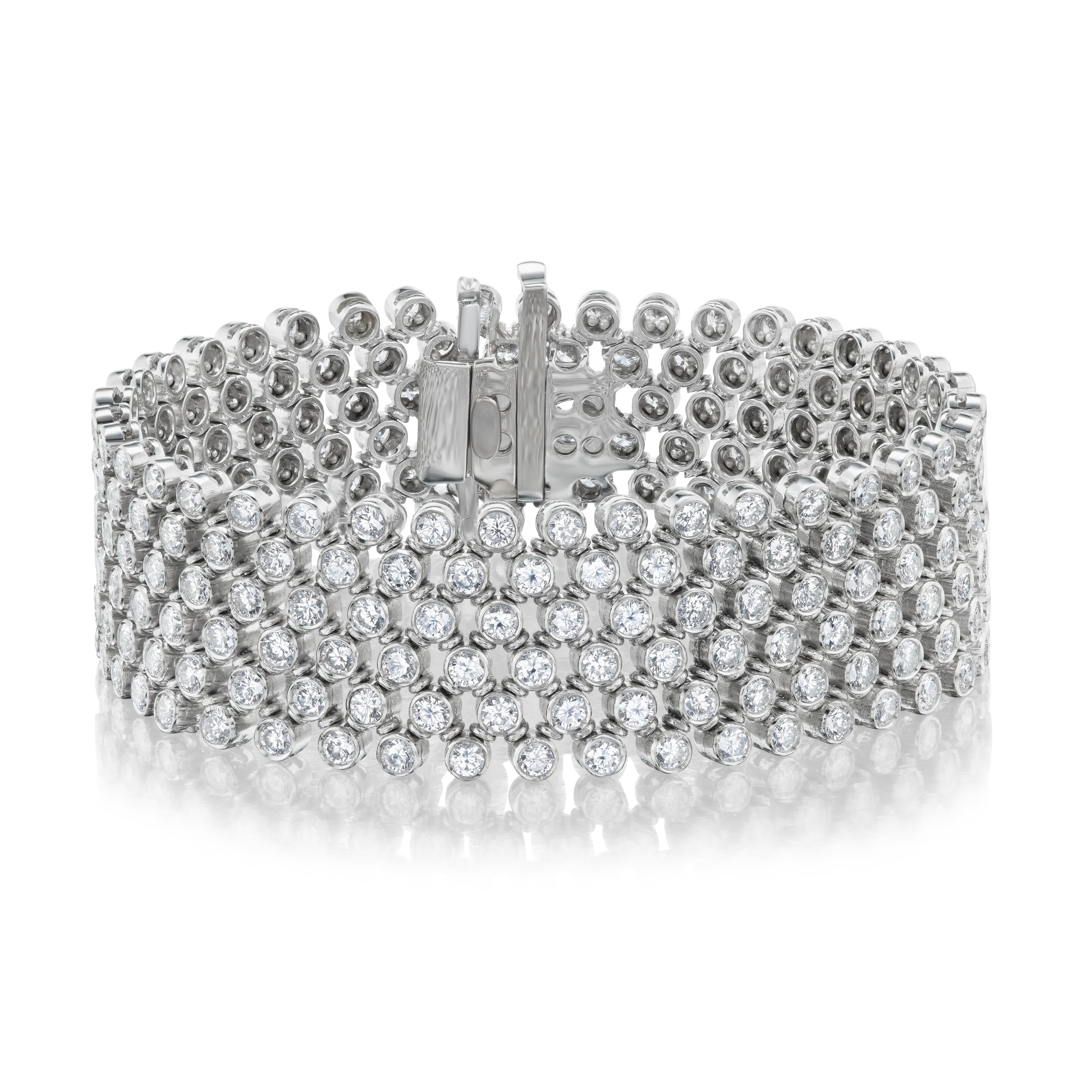 Six rows of perfectly matched, precision set and expertly engineered diamond beauty.  The flexibility is second to none resulting in an extraordinarily comfortable and mesmerizing show of brilliant light.

This wonderful jewel was crafted in