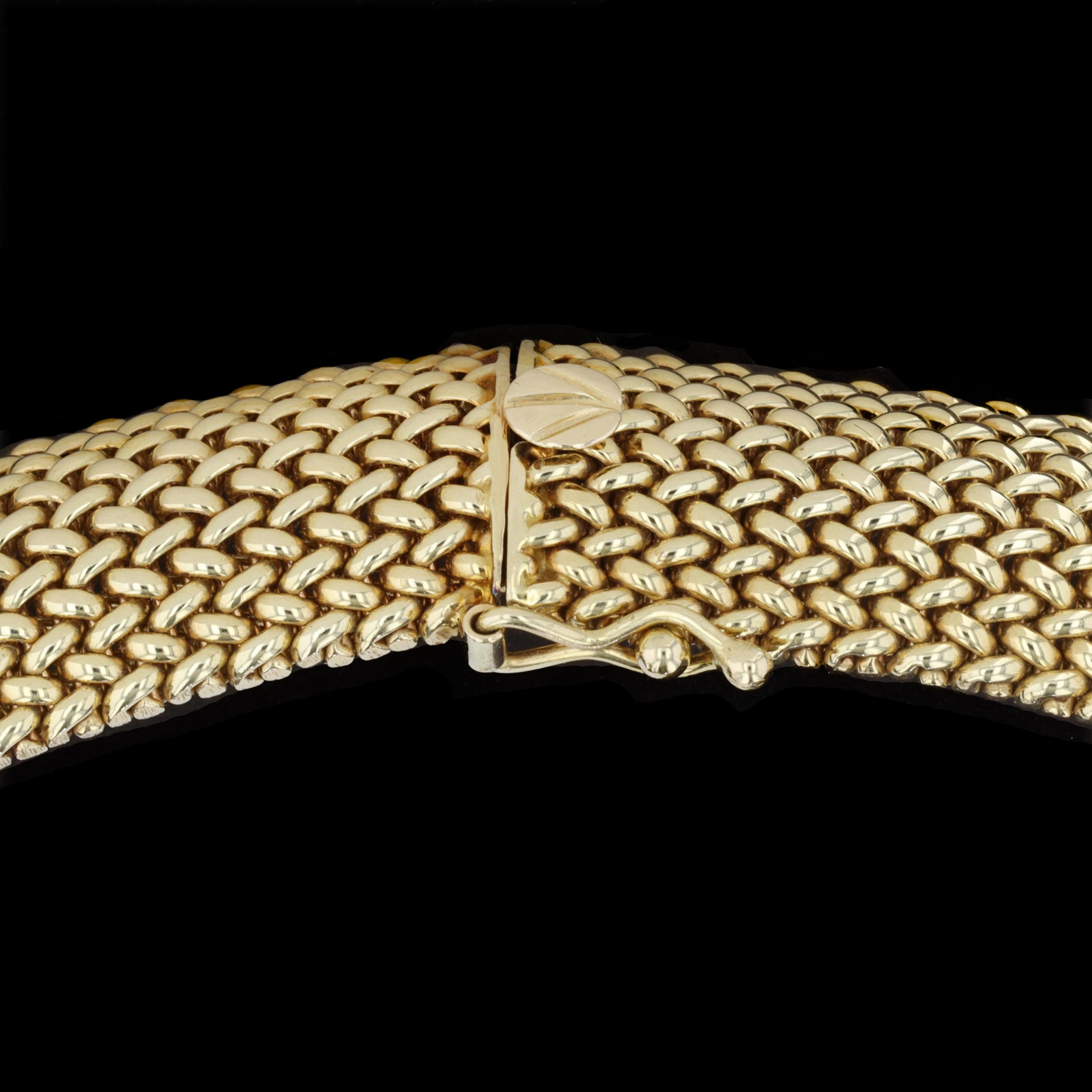 Weave a tale of elegance with this striking 14kt yellow gold mesh estate necklace. 

The necklace measures .55 in width and 15.75 inches in length. The necklace is stamped 14K and weighs 87.5 grams.