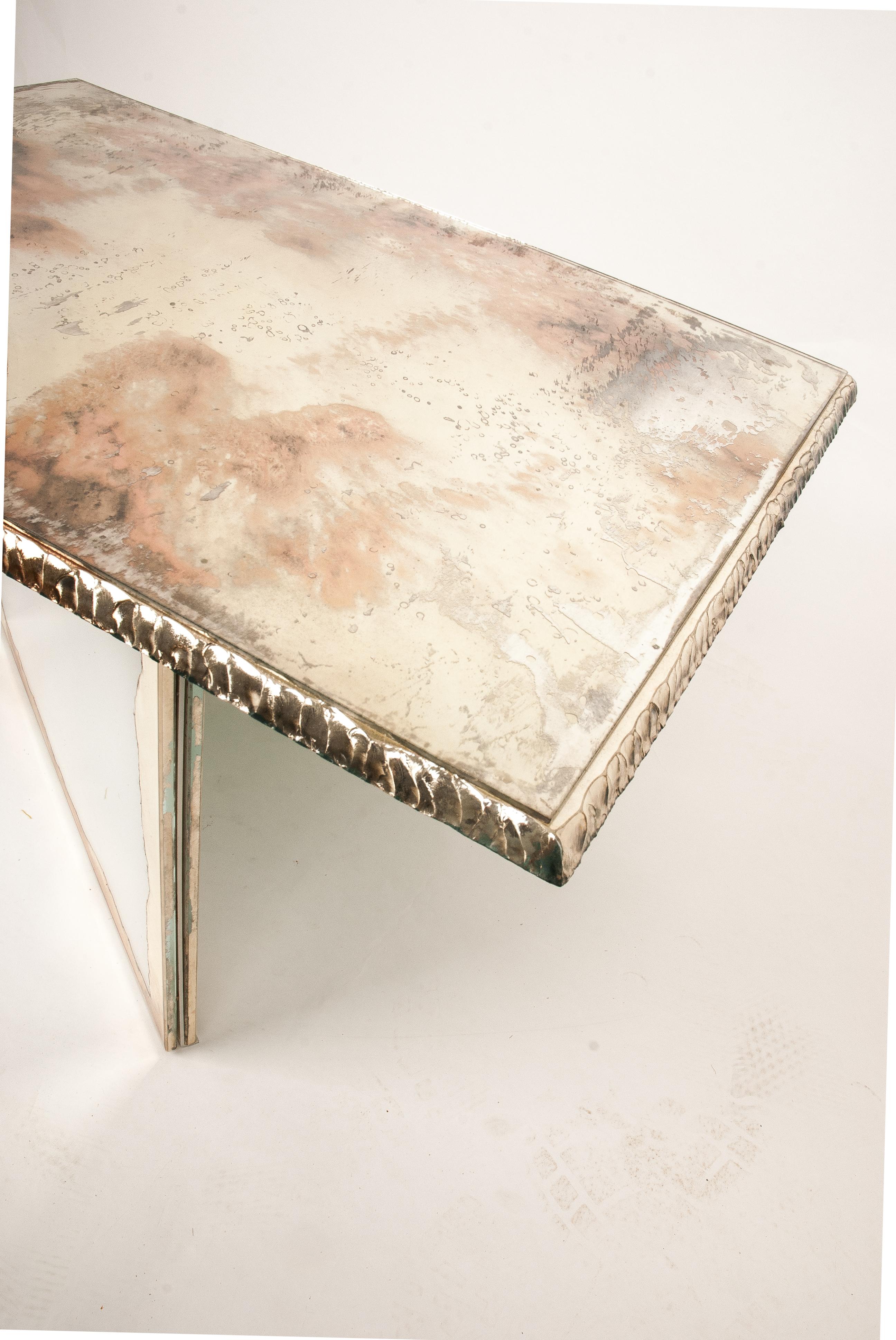 FLIGHT contemporary side table, art glass silvering

This table is a piece of contemporary art, entirely made by hand in Tuscany, Italy, 100% of Italian origin. 
The table, reminiscent of wings in flight, with its colored free-positionable legs  and