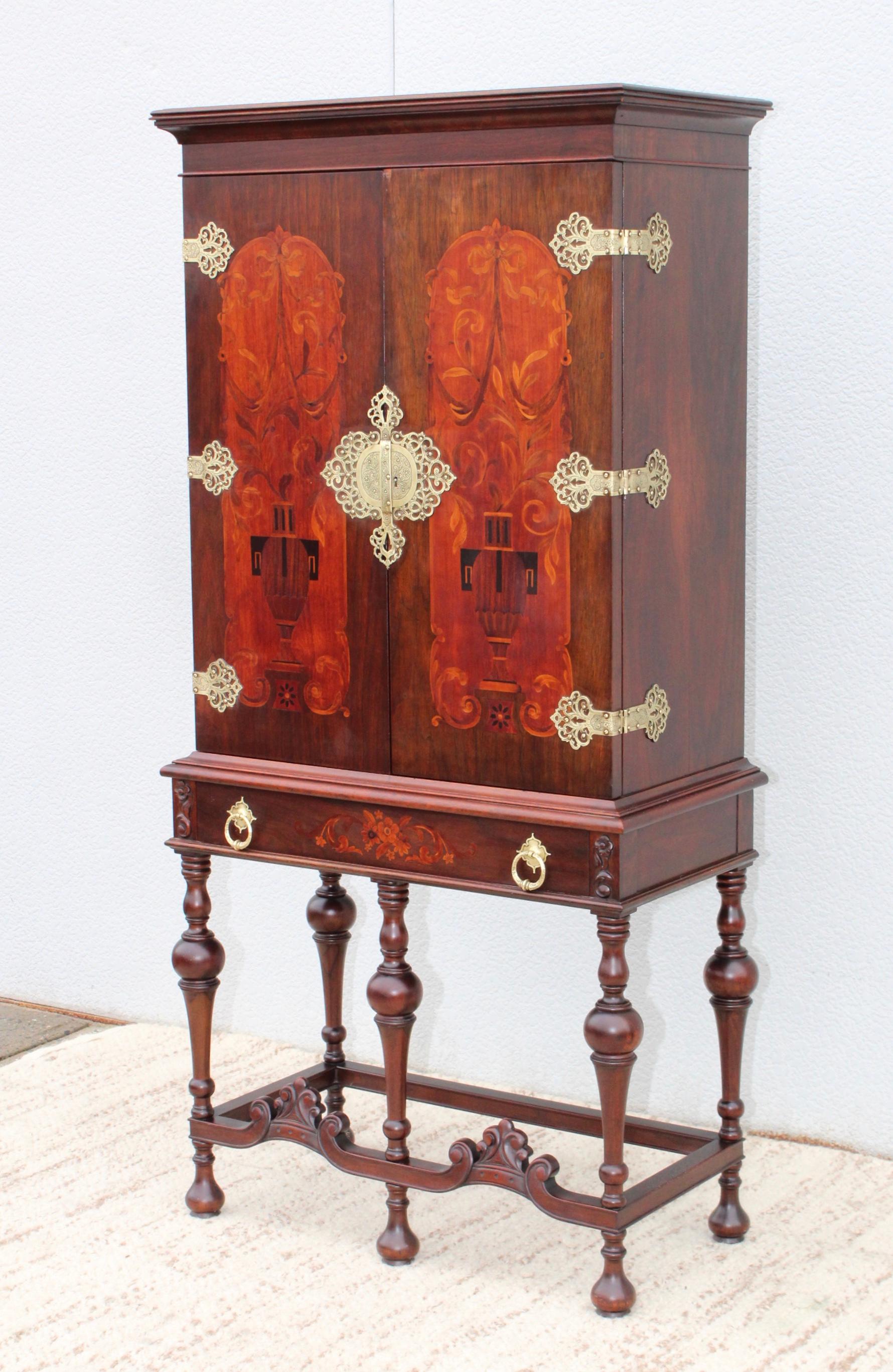 Stunning 1940s walnut with brass hardware tall cabinet by Flint & Horner, in vintage original condition with some wear and patina due to age and use.