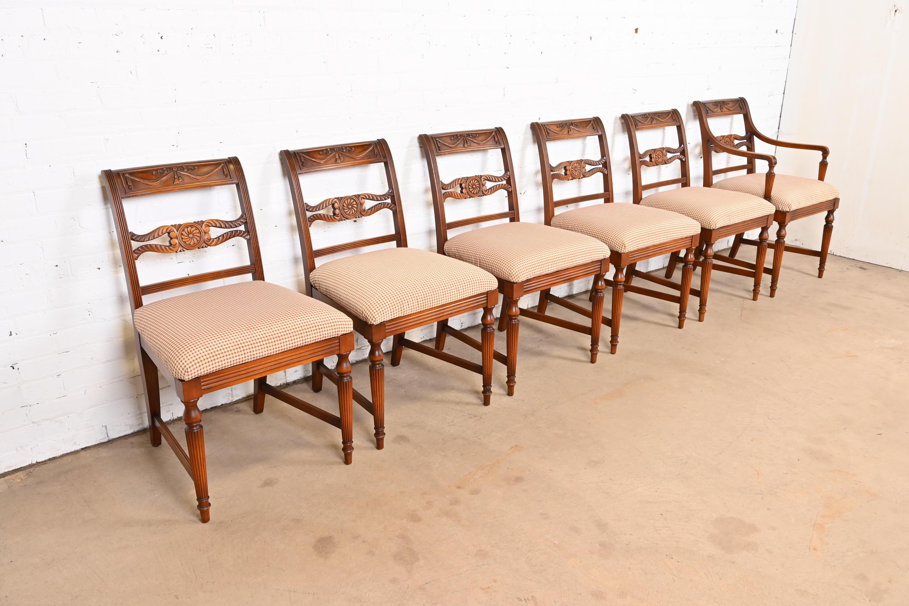 A gorgeous set of six French Regency Louis XVI style dining chairs

By Flint & Horner

USA, Circa 1930s

Carved cherry wood frames, with upholstered seats.

Measures: 24