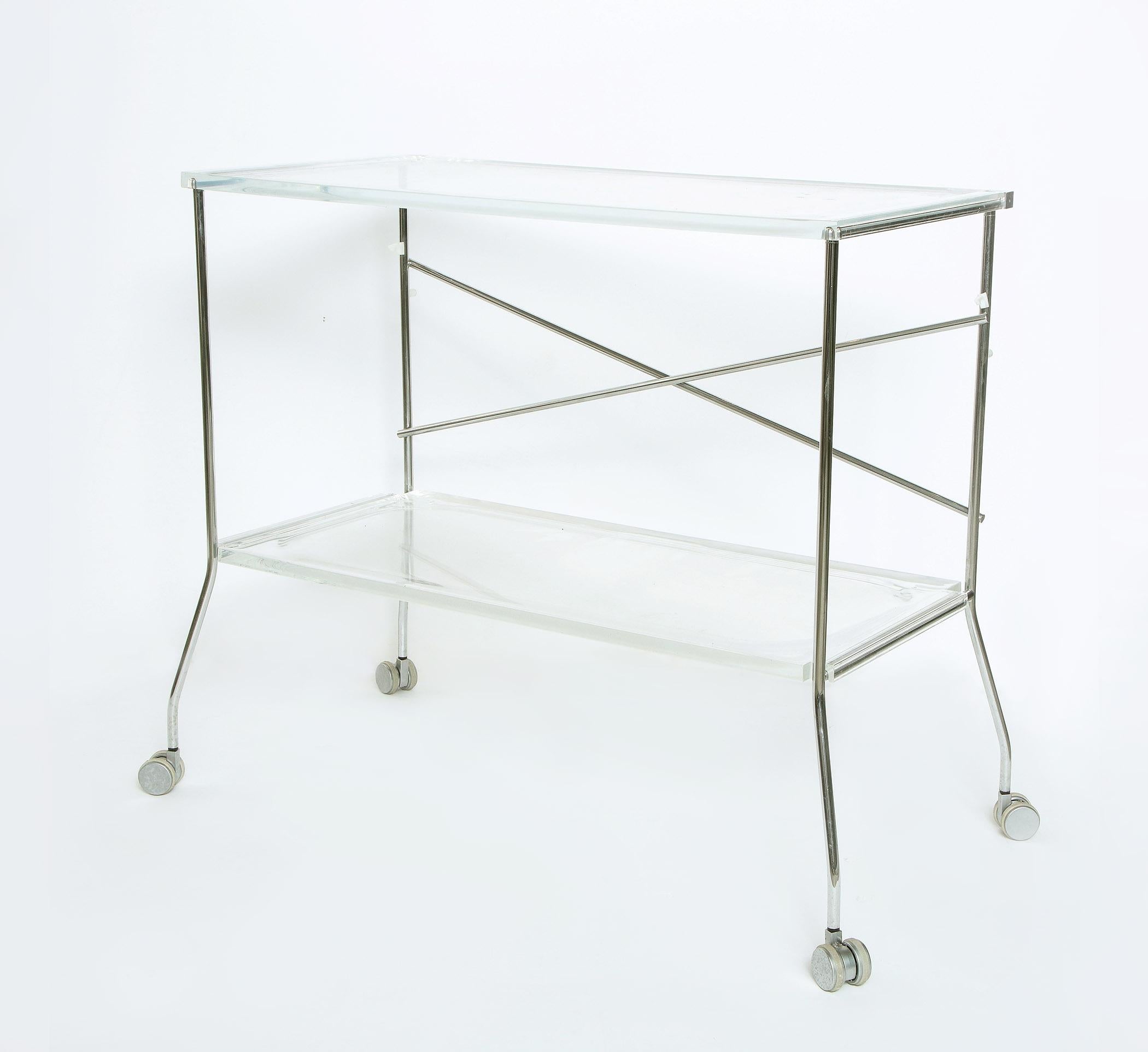 Lucite and stainless steel folding cart on casters.