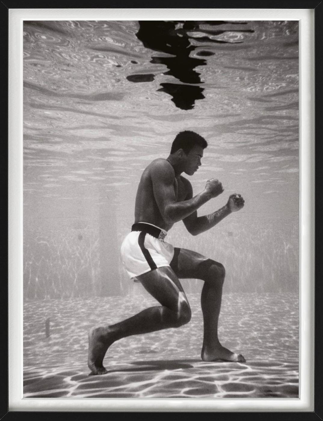 Ali Underwater - boxer Muhammad Ali training underwater in a pool - Gray Black and White Photograph by Flip Schulke