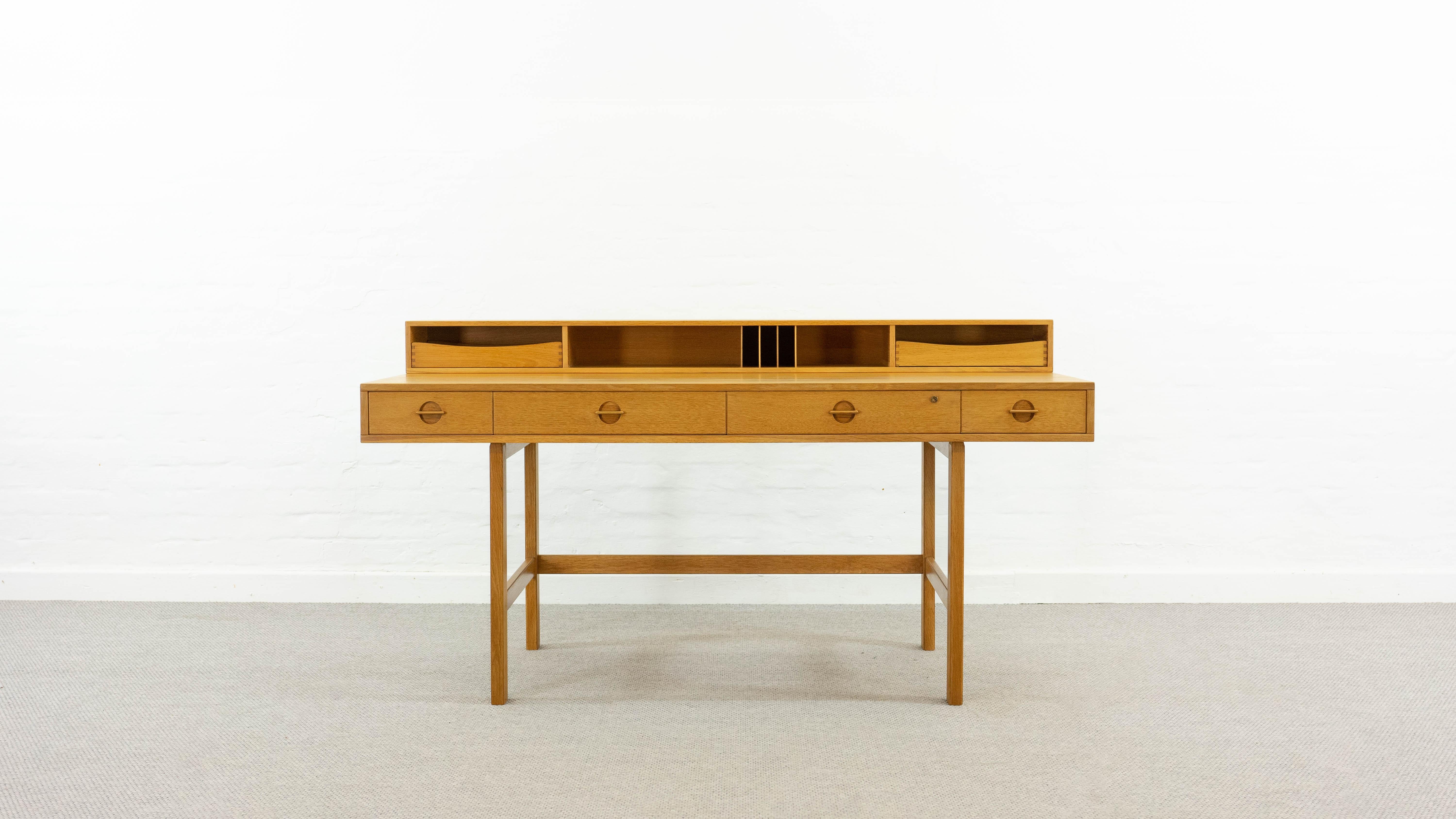 Flip-Top Desk by Jens Quistgaard for Peter Løvig Nielsen, Denmark. A top example of the mid century danish design movement. The top piece/shelf is hinged and the table can be converted in a larger working table-top for 2 people. The table is