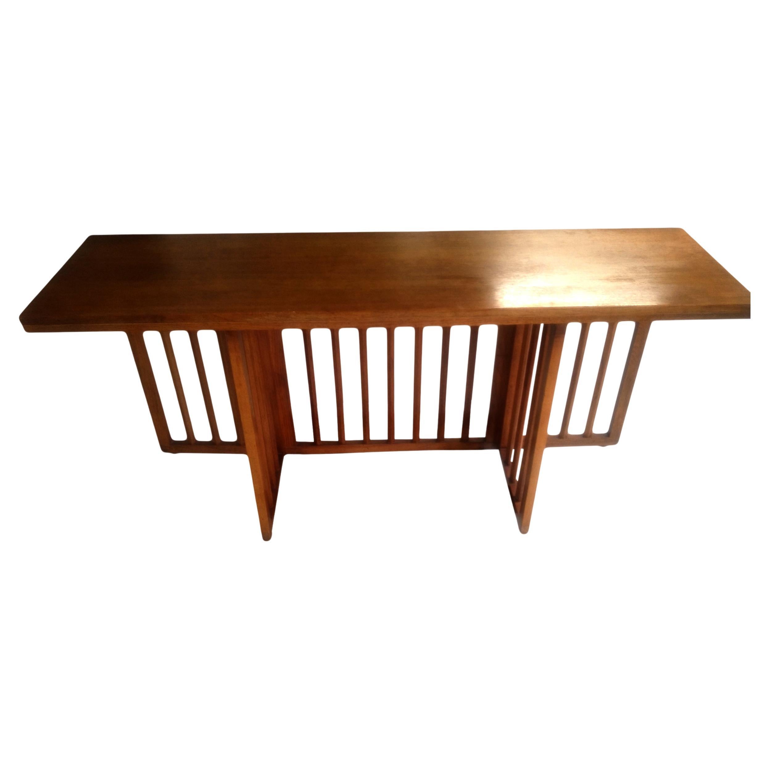 Flip top dining or console table by Harvey Probber

Versatile Walnut with gatefold base that allows table to expand from console to dining table
 two pull-out locks on both ends
 Dimensions when the table is folded: 60