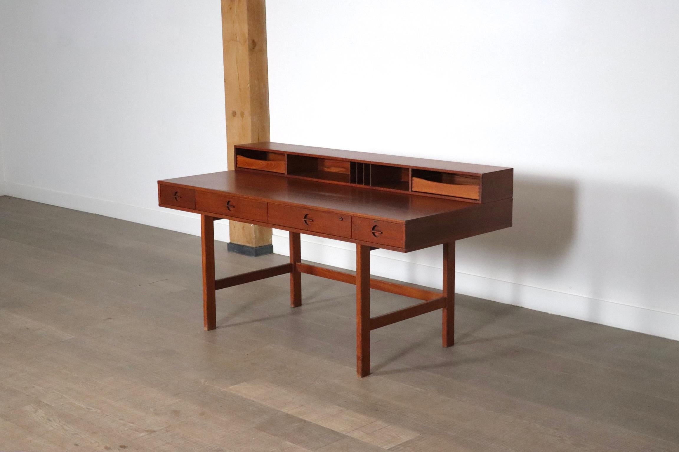 Nice Flip-Top desk designed by Peter Løvig Nielsen and often attributed to Jens Quistgaard, this ingenious desk has a shelf that flips, creating a flat work surface. Ideal as a shared desk for a studio or office. Full surface with measures 96cm.