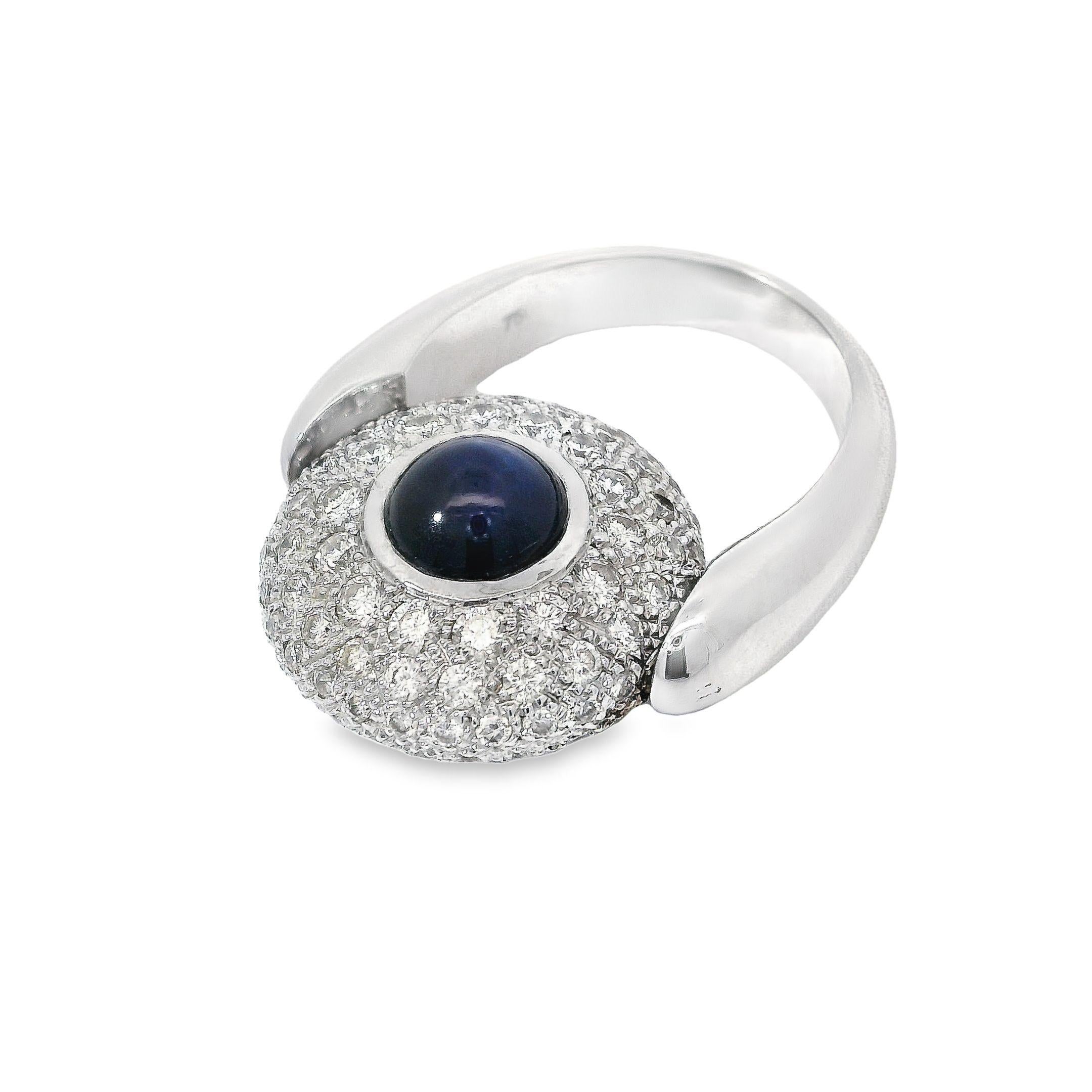 Indulge in opulence with this breathtakingly beautiful and versatile ring that showcases a bold yet elegant design. Crafted from 18K white gold weighing 15.128g, this ring radiates a sense of luxury and sophistication.

At its center lies a majestic