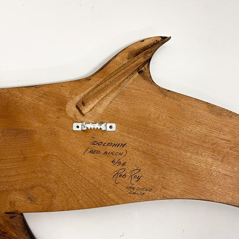Wall sculpture
Dolphin wood wall sculpture in red birch.
Signature and inscription signed Rob Roy, Red Birch, San Diego CA 6/94.
Dimensions: 24