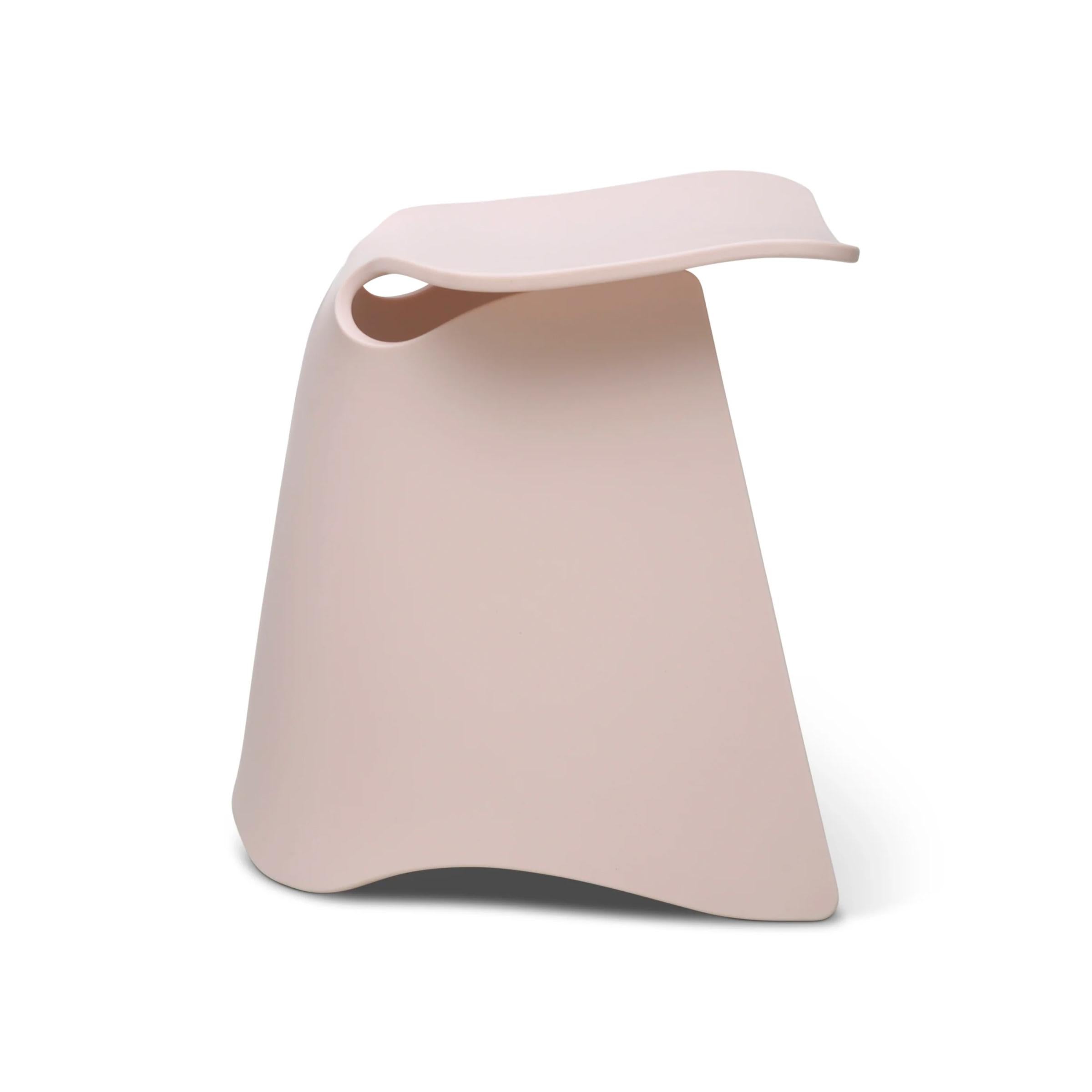 Flo stool is made of one single piece of thermoformed Corian, a durable countertop material with a stone-like feel. Inspired by the form of a cresting wave, the folds and curves create a structural base and comfortable seat and give the piece an