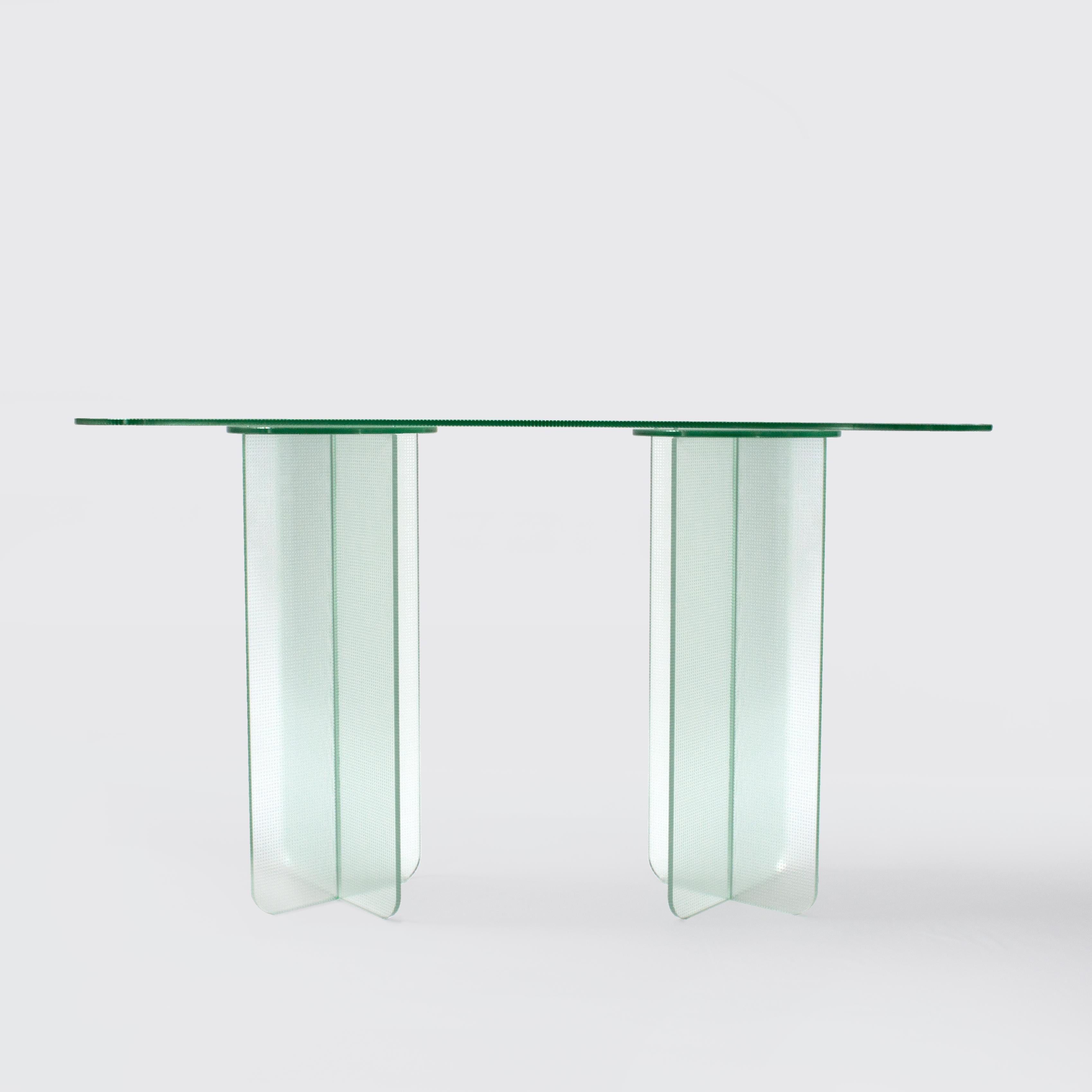 Float collection explores transparent form with a subtle overlay of texture, transforming simple tables into light shape-shifting pieces. Made entirely of glass Float’s seamless form changes depending on its viewing angle, with material opacity,