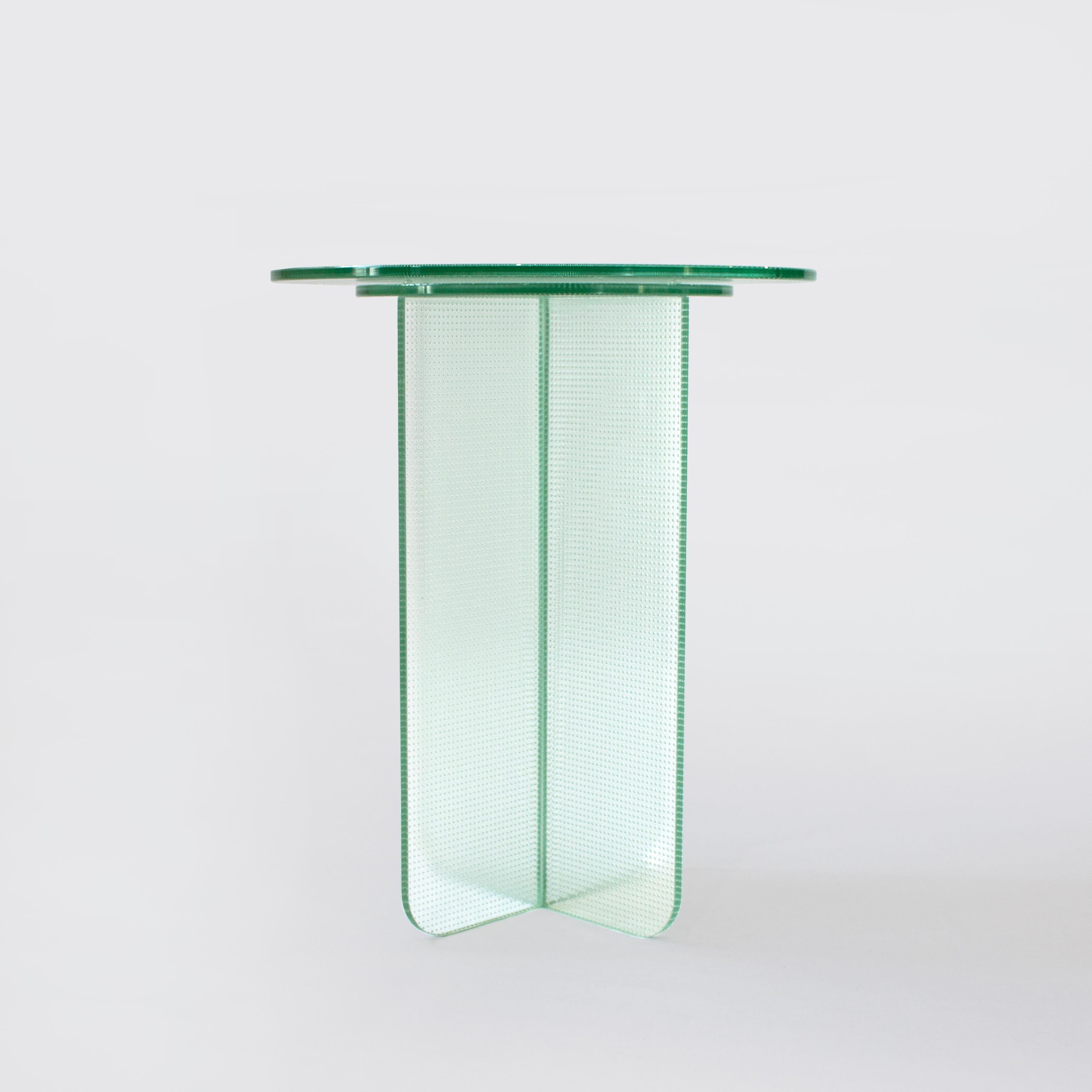Float collection explores transparent form with a subtle overlay of texture, transforming simple tables into light shape-shifting pieces. Made entirely of glass Float’s seamless form changes depending on it’s viewing angle, with material opacity,