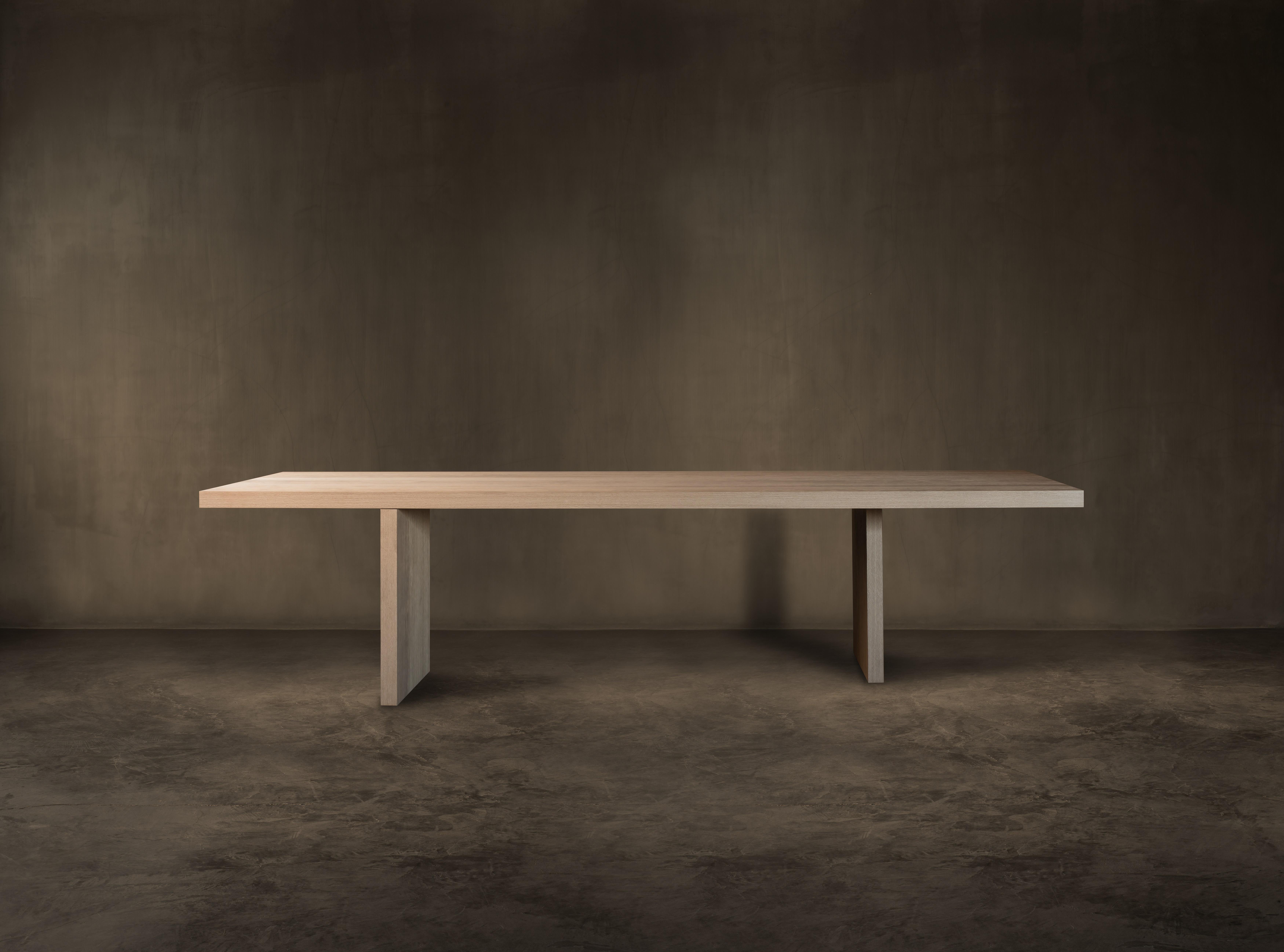 Float table by Kana Objects
Dimensions: D 110 x W 260 x H 73 cm
Materials: Natural oak.
Available in other sizes: 260, 280, 300, and 320 cm.
Also available in smoked oak. 

The diagonal positioning of Float’s legs, handmade in noble oak