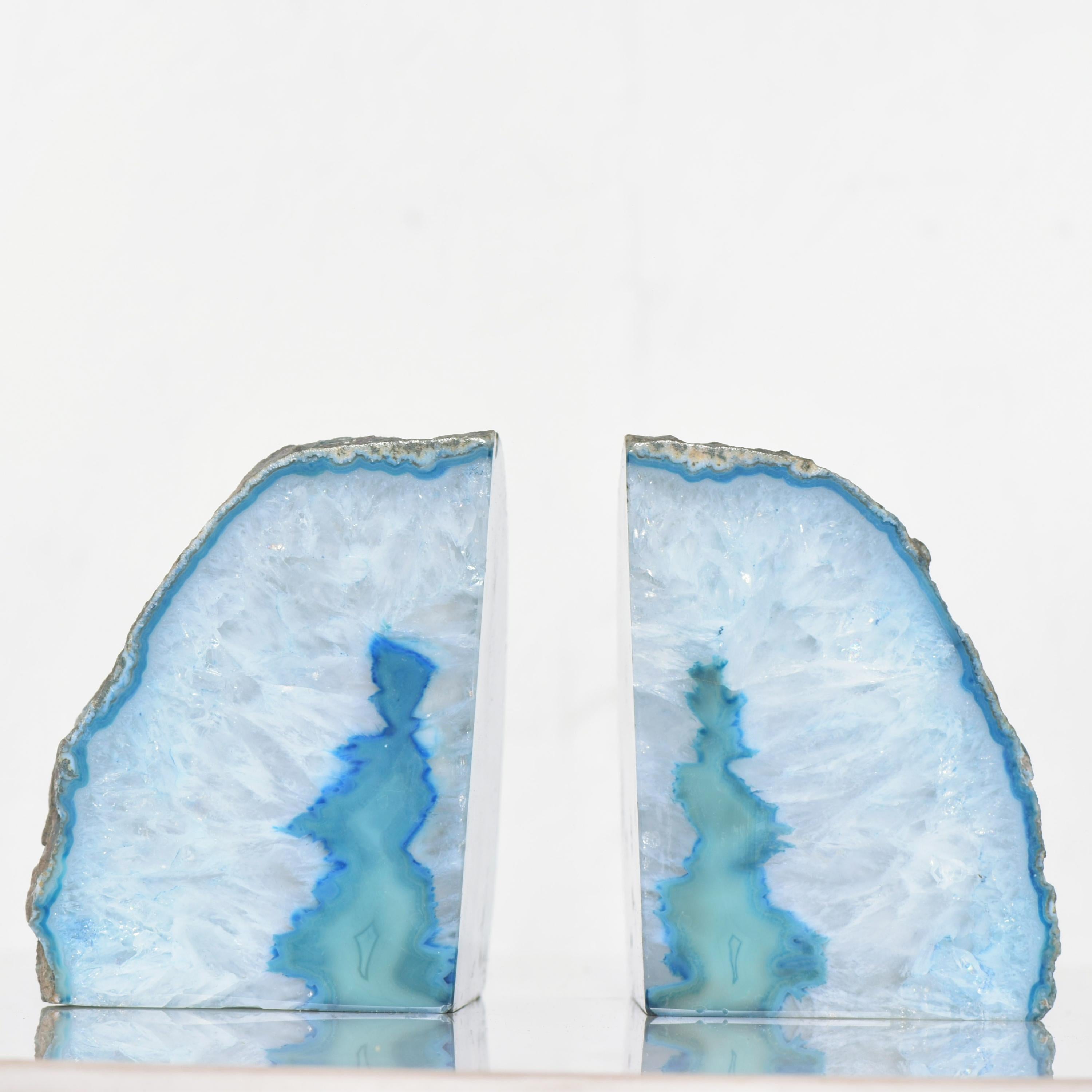 Midcentury pair of organic modern bookends in polished floating sea of blue quartz stone 
Breathtakingly beautiful, circa 1970s
Measures: 4 1/2