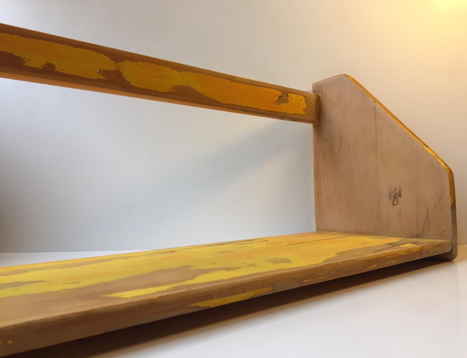 Vintage Danish modern oak shelf with rustic yellow lacquer treatment. Designed by Hans Jorgen Wegner
and manufactured by Ry Møbler in during the 1950s.