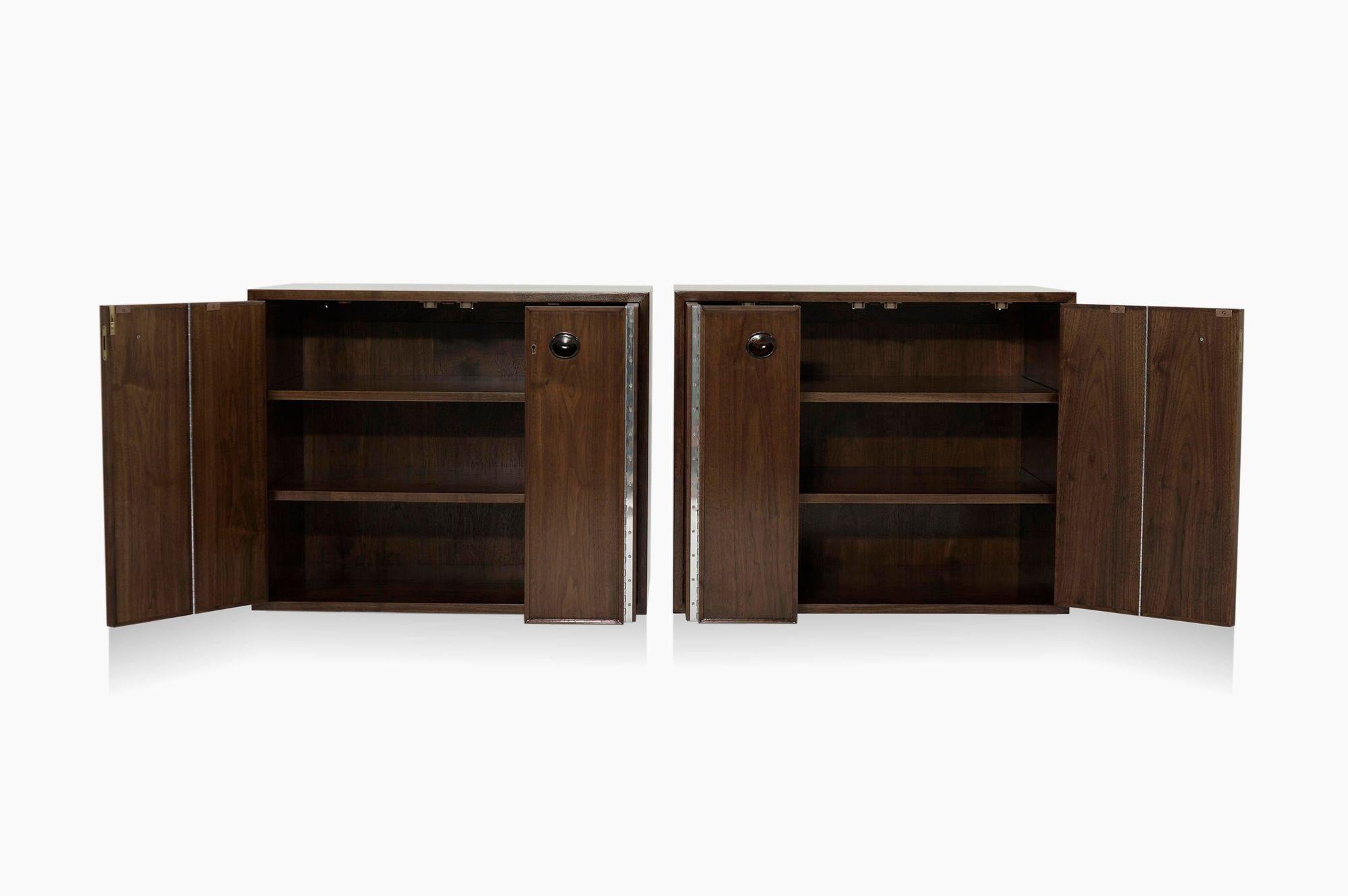 Elevate your interior with these exquisite mid-century floating cabinets, masterfully designed by the iconic Edward Wormley for Dunbar in the 1950s and meticulously restored to their original glory by Stamford Modern. Crafted from rich walnut, these