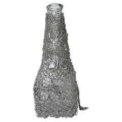 Vaso “Floating Chainmail”, realizzato in Steele e vetro, di Panorammma, Messico