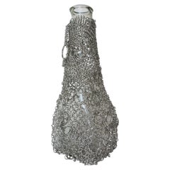 Vaso “Floating Chainmail”, realizzato in Steele e vetro, di Panorammma, Messico