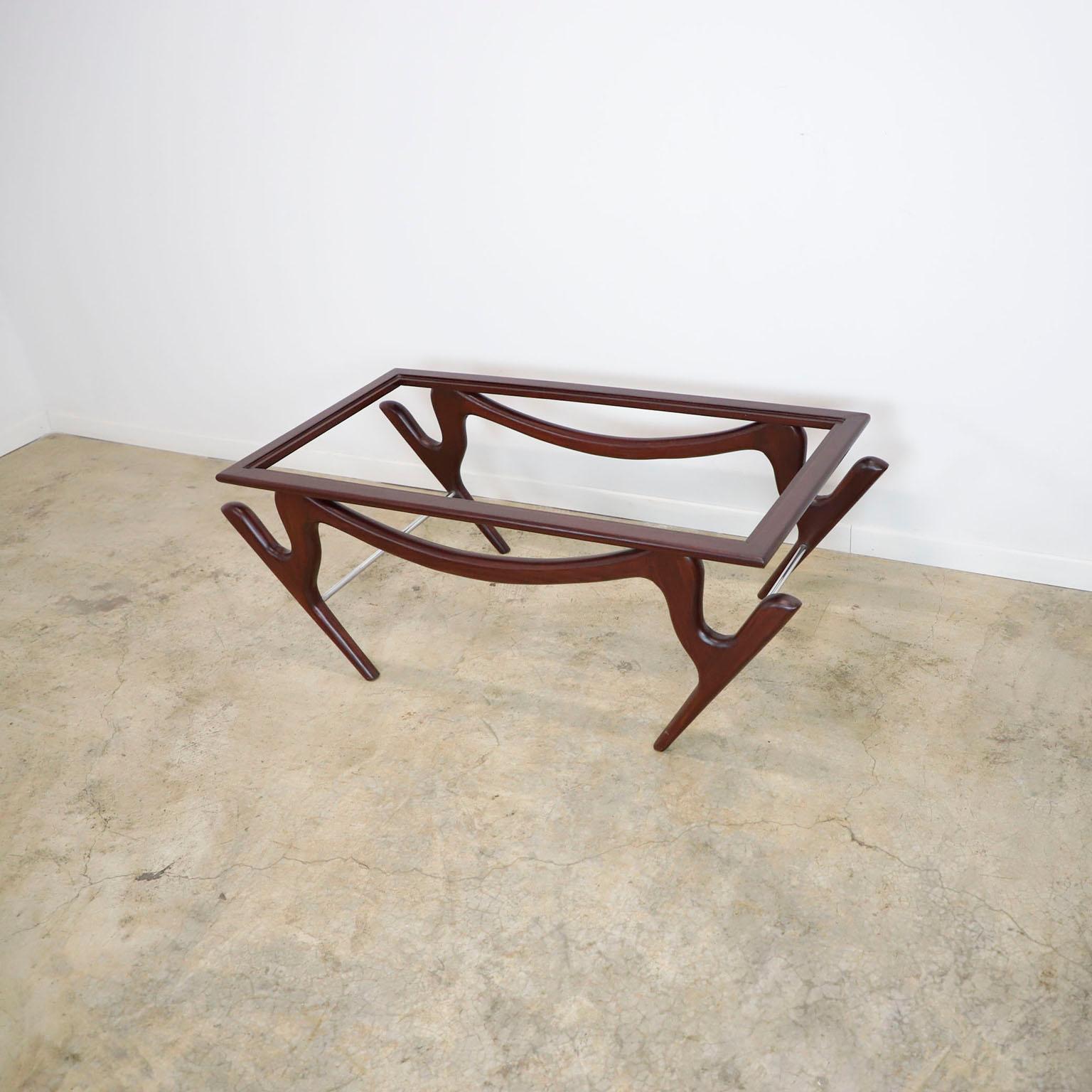 We offer this coffee table with the amazing and characteristic design of Eugenio Escudero, made in México in mahogany wood, circa 1950. We do not include glass for best shipping.