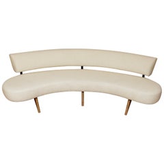 Floating Curved Sofa on Sculptural Walnut Legs