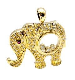 Floating Diamond and Pave Elephant Pendant with Ruby Eye in 18 Karat Yellow Gold
