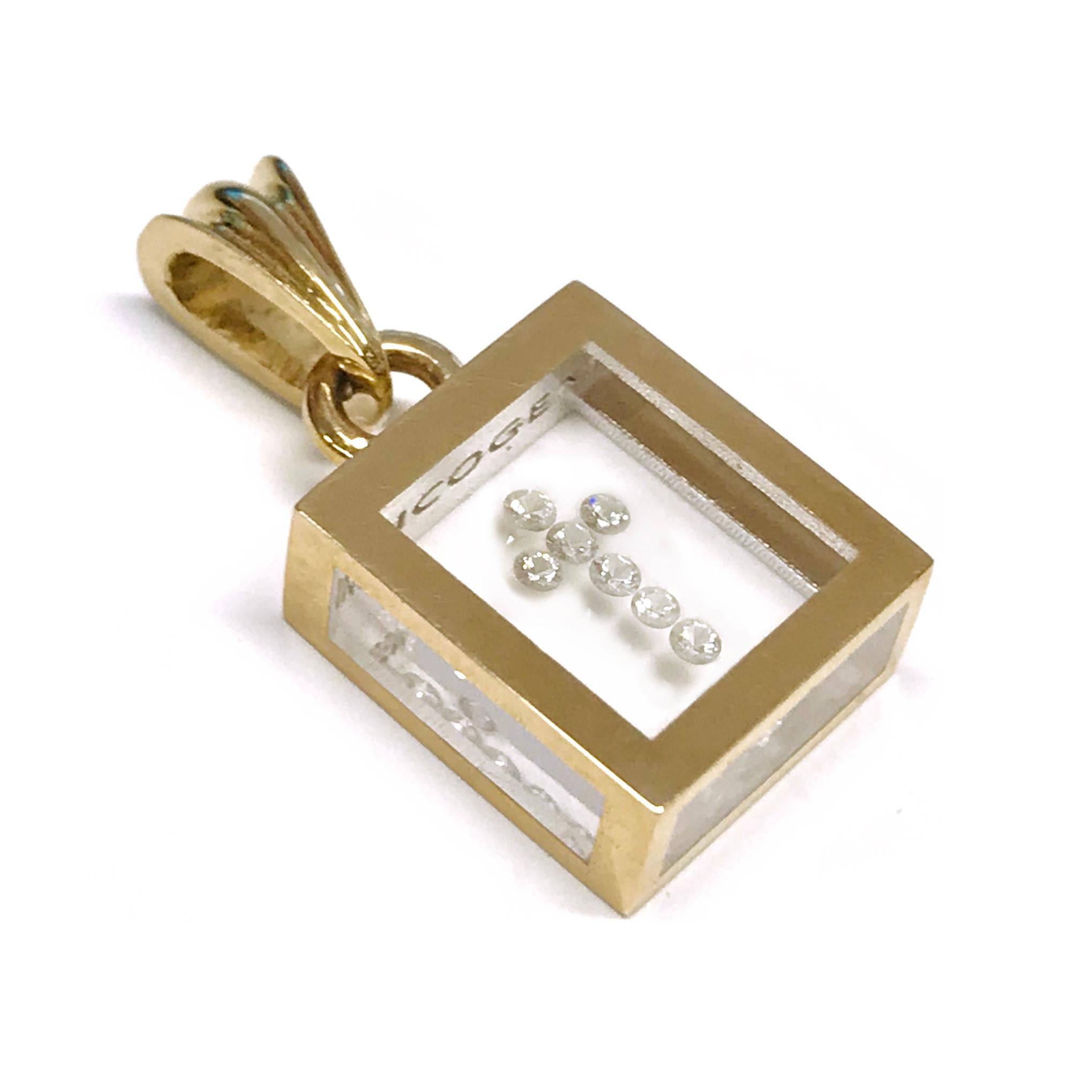 Incogem Floating Diamond Cross Pendant: 14k Yellow Gold. The pendant is handcrafted of recycled 14k yellow gold. The diamonds are brilliant-cut, 58 facets, VS1 in clarity (G.I.A.), and H in color (G.I.A.). Each diamond weighs 0.015 carat. The