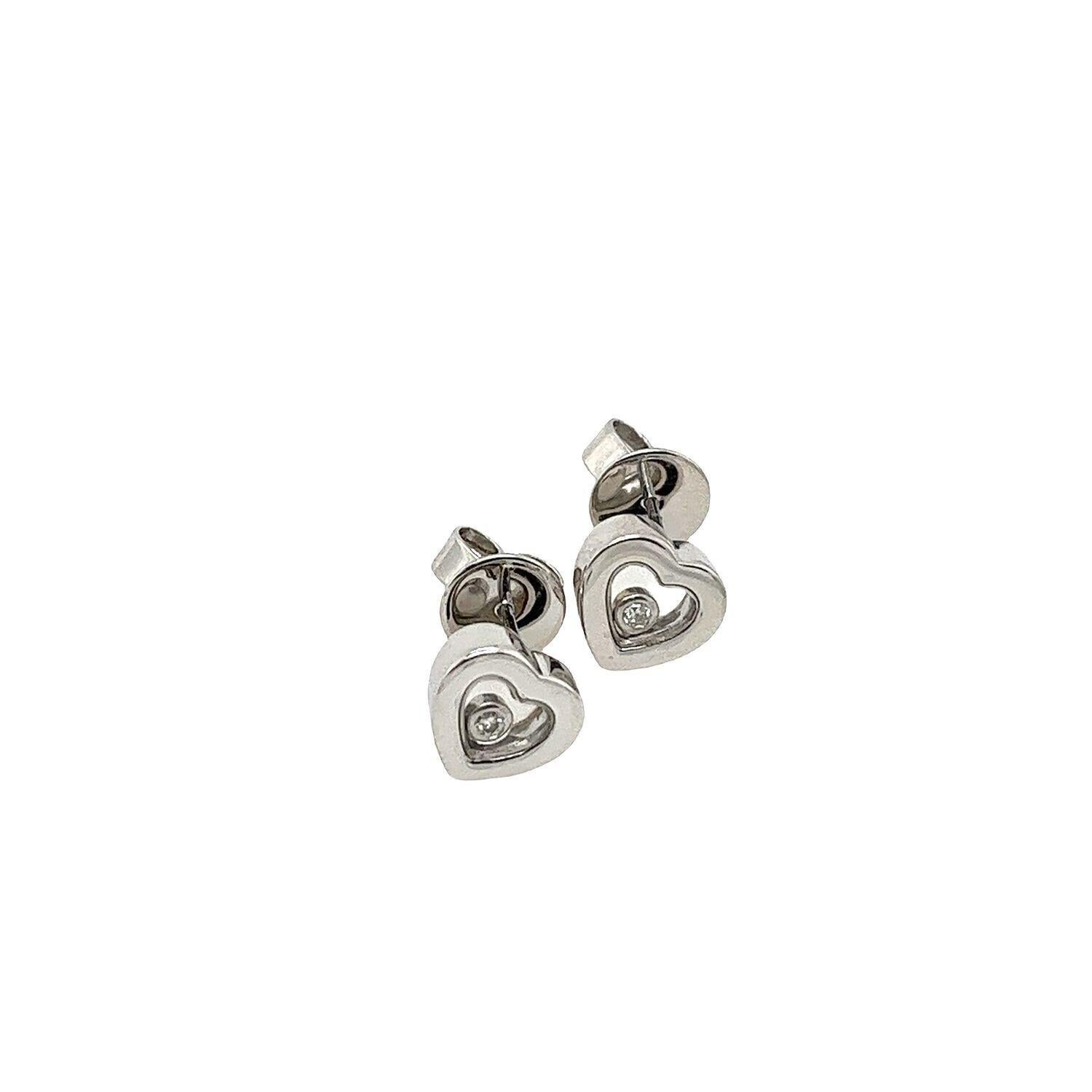 This pair of Diamond stud earrings features 2 floating round brilliant cut Diamonds set in 18ct White Gold in a heart shape. It's perfect for every day and can be worn with any outfit.

Additional Information:
Diamond Colour: F
Diamond Clarity: