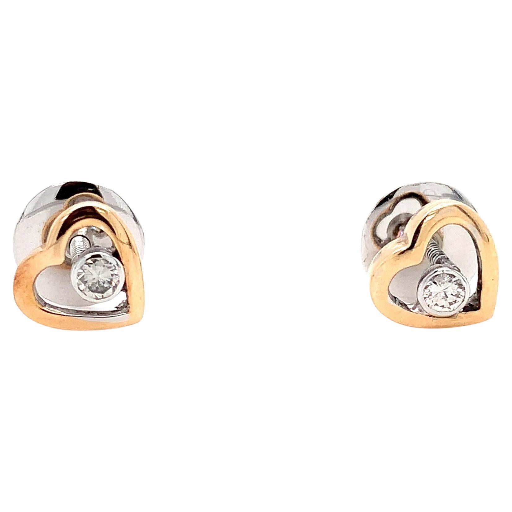 Floating diamond heart shaped stud earrings 18k rose and white gold