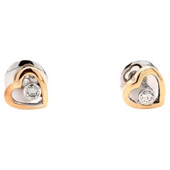 Floating diamond heart shaped stud earrings 18k rose and white gold