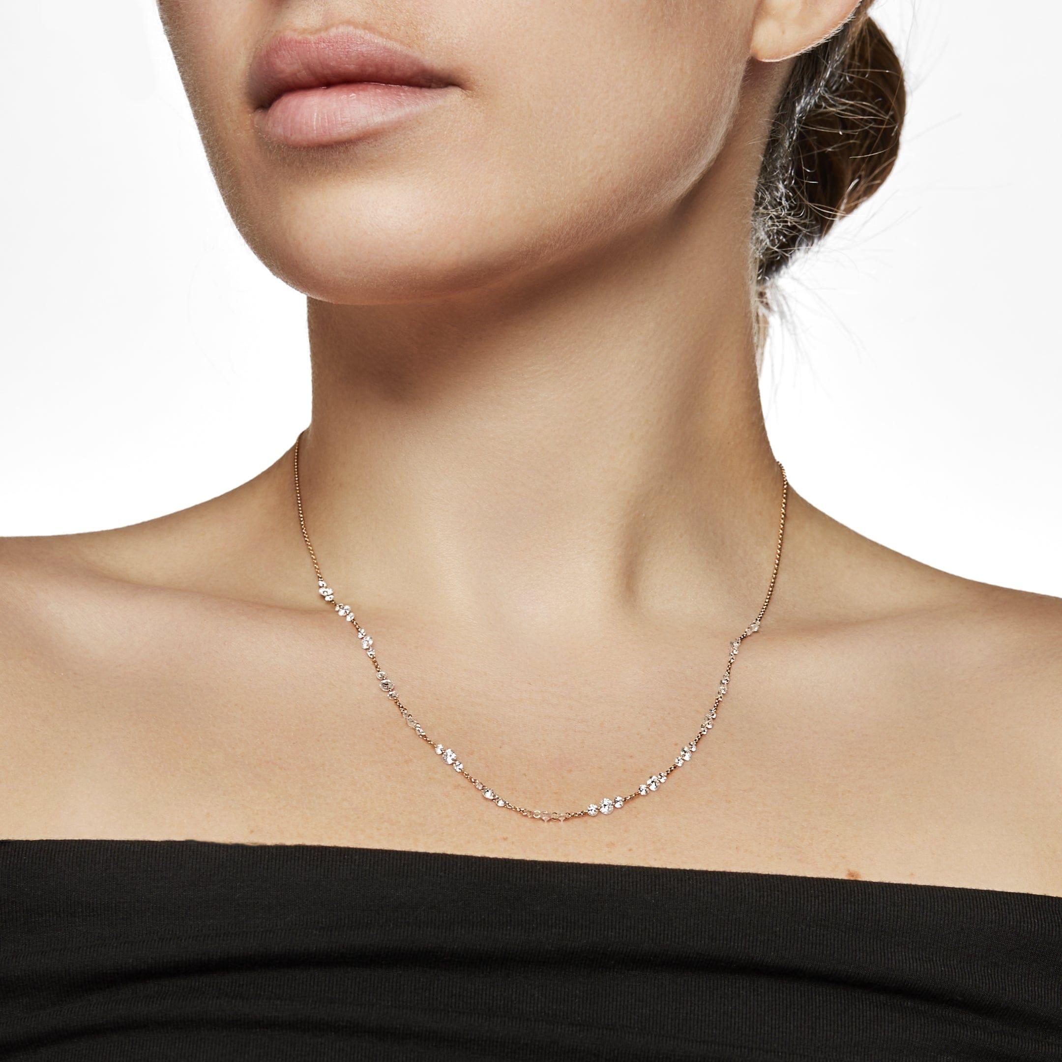 Diamond trios set on a delicate 18-karat yellow gold chain emit an ethereal energy in the Floating Trio Diamond Tennis Necklace. Round diamonds are expertly laser-drilled to perfectly integrate with the gold links, providing intermittent flashes of