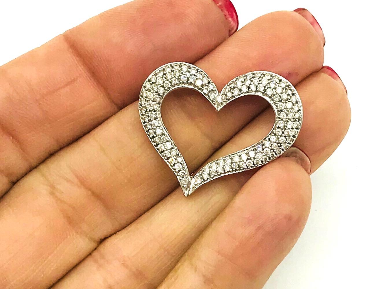 Floating Heart, 1.00 Ct Diamond Pave, 14 Kt Gold; Large heart with open setting consists of diamond with a total weight of estimated 1.00 carat. Graduating diamond sizes. Quality of SI1-2 clarity and color G-H.
 Backside openings for a chain to be