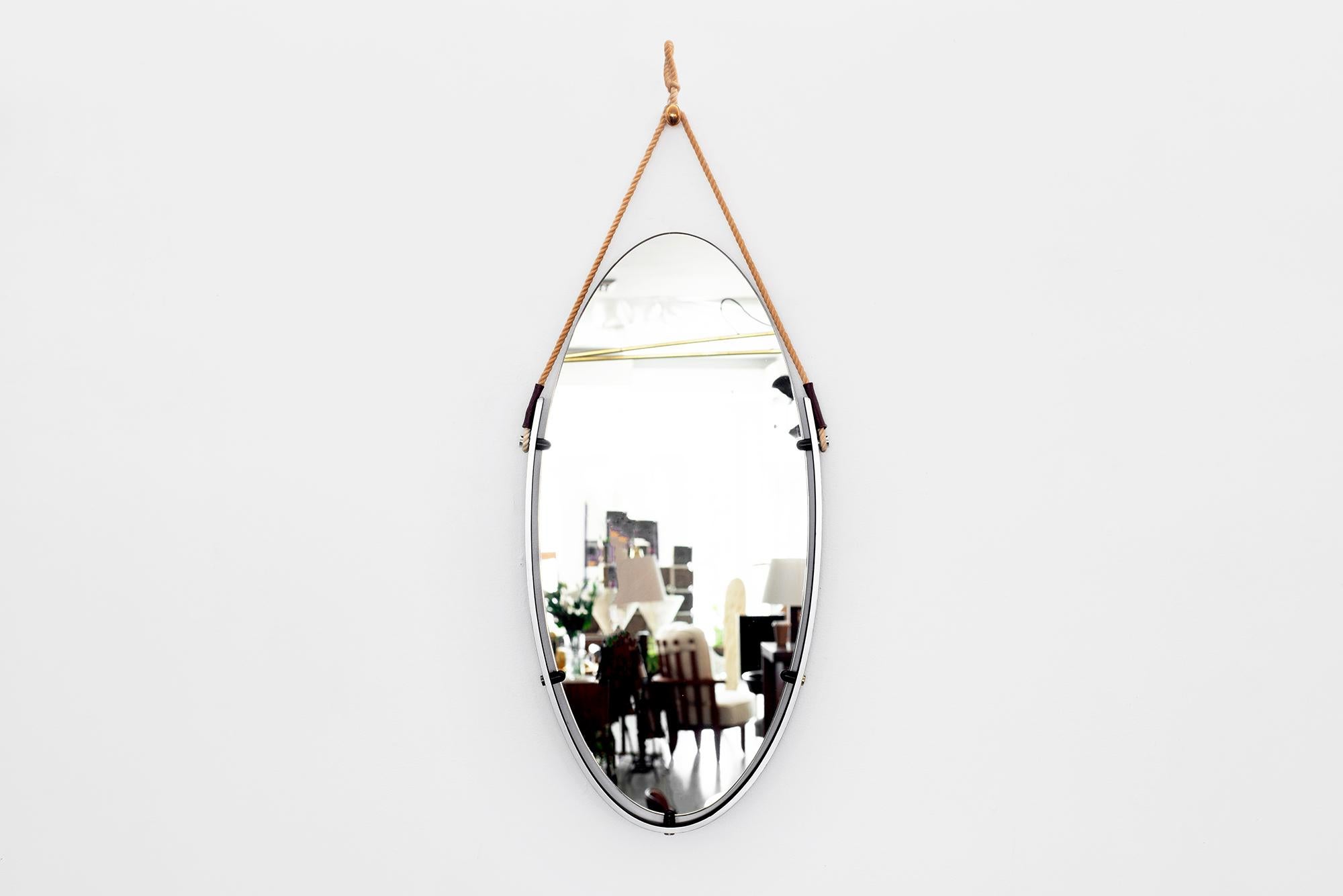 Fantastic 1960s Italian mirror floating in iron frame with rope and leather detail.
Oval shape with open edged top 

Overall dimensions including rope:
W 15 1/2”
H 41”
D 1 1/4”.