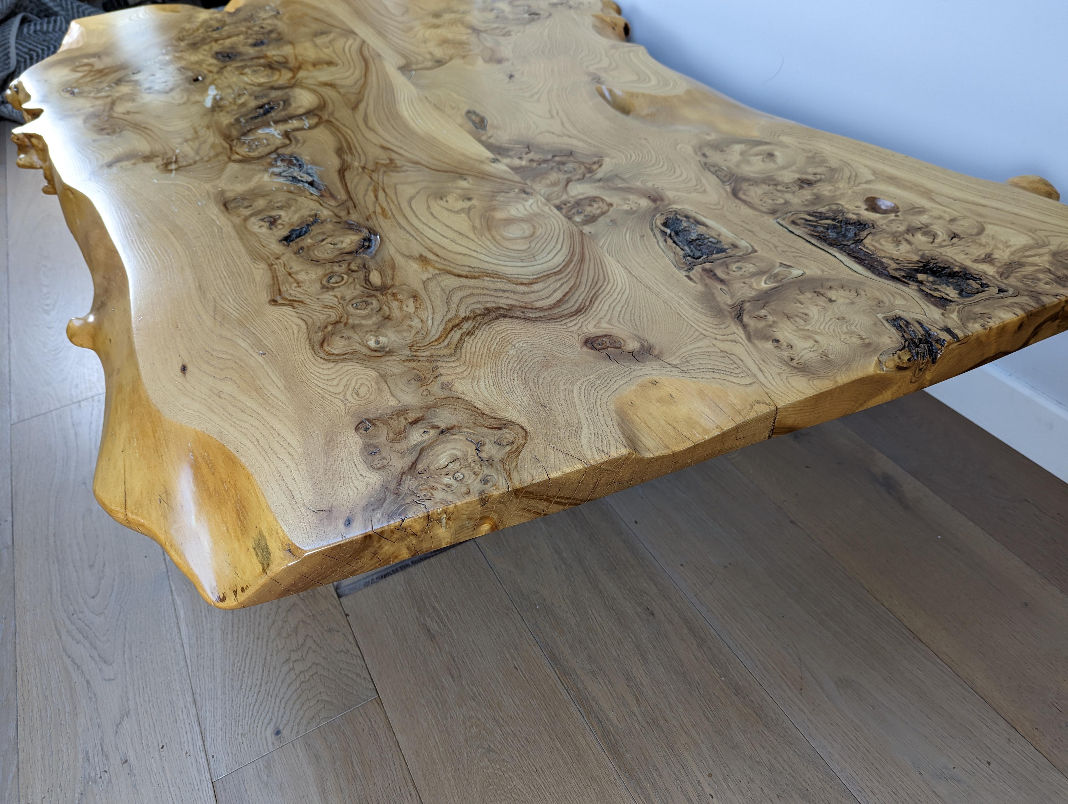 A stunning mid-century burr Elm coffee table in the style of George Nakashima

The table is sat on 2 thick Lucite blocks, to give the impression that the table is floating in mid-air.

The slab is very thick and has been previously polished which