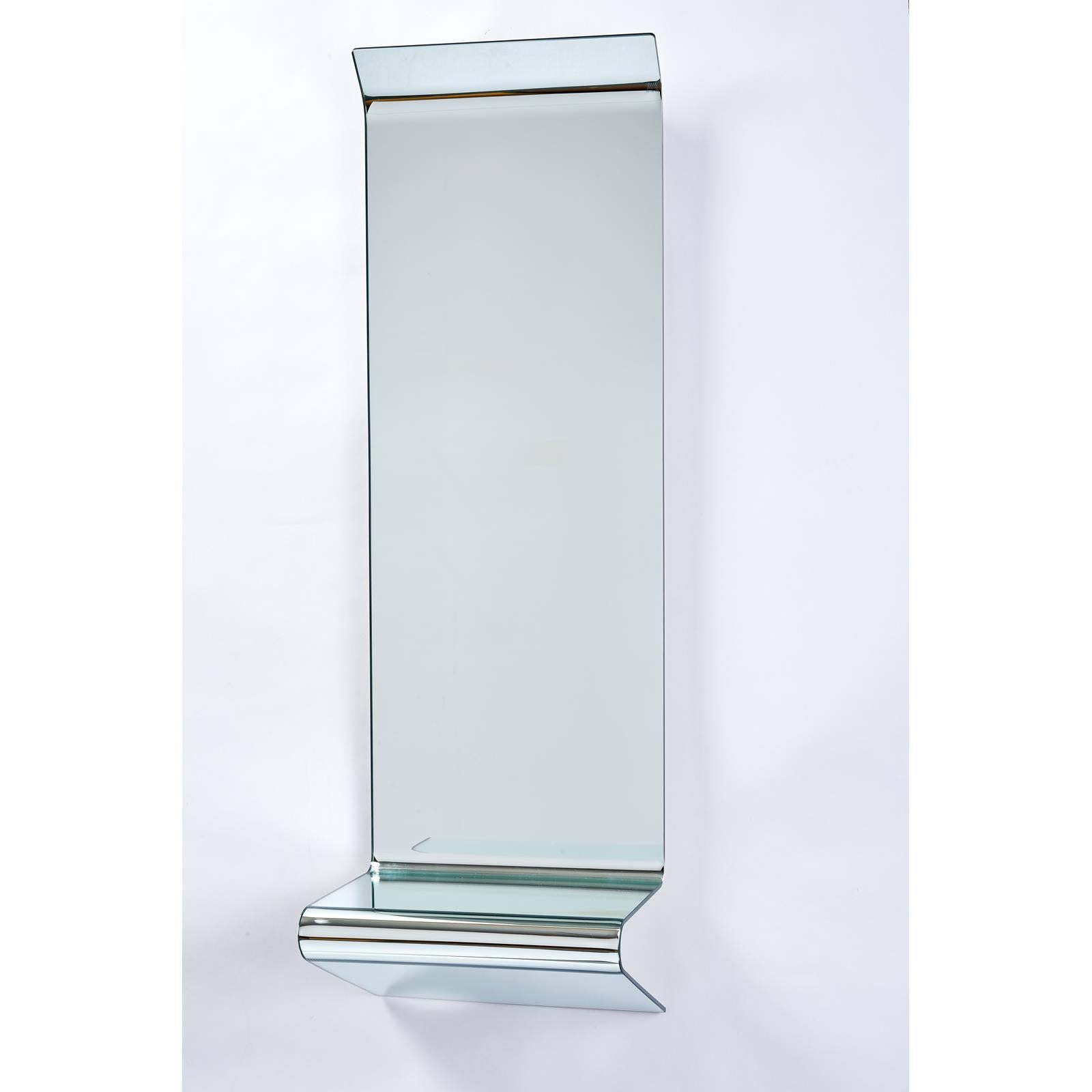 Fiam Italia, 2005.
Floating mirrored console by FIAM formed of a single sheet of folded mirrored glass, with angled top edge and integral shelf.
Makers mark and date
Measures: 44 H x 14.25 W x 11.5 D.

 