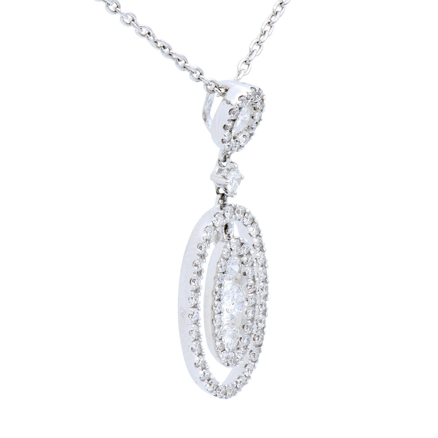 This beautiful pendant is made of 65 round VS2, G color diamonds totalling 0.62 carats to create unique oval design hanging from a round haloed diamond on top. The diamonds are set in 1.5 grams of 18 karat white gold. Included is an 18 karat white