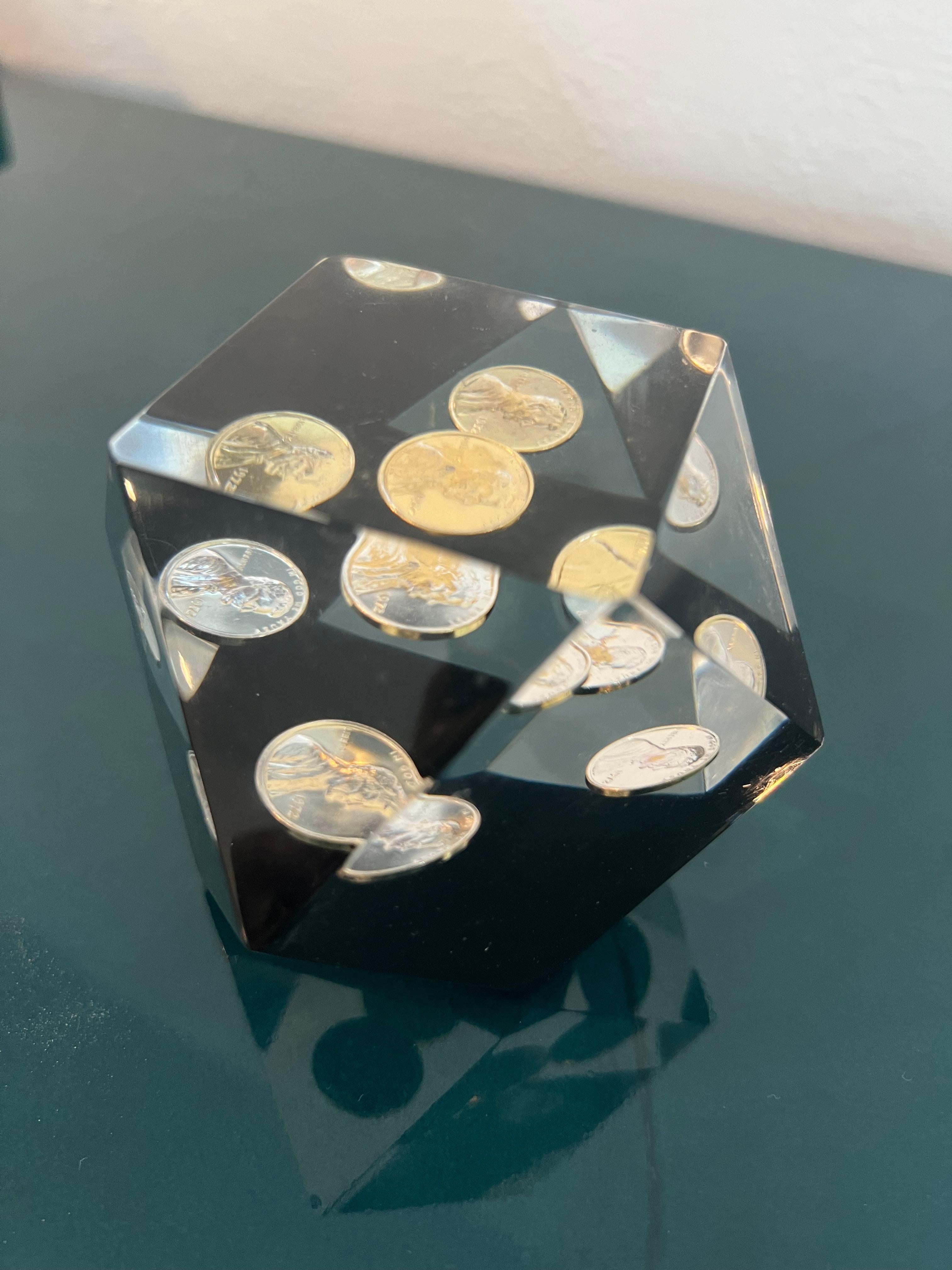 Floating penny geometric lucite paperweight. Consisting entirely of 1972 pennies. Scratches and scuffs found throughout, consistent with age and use. Please refer to photos.

Would work well in a variety of interiors such as modern, mid century