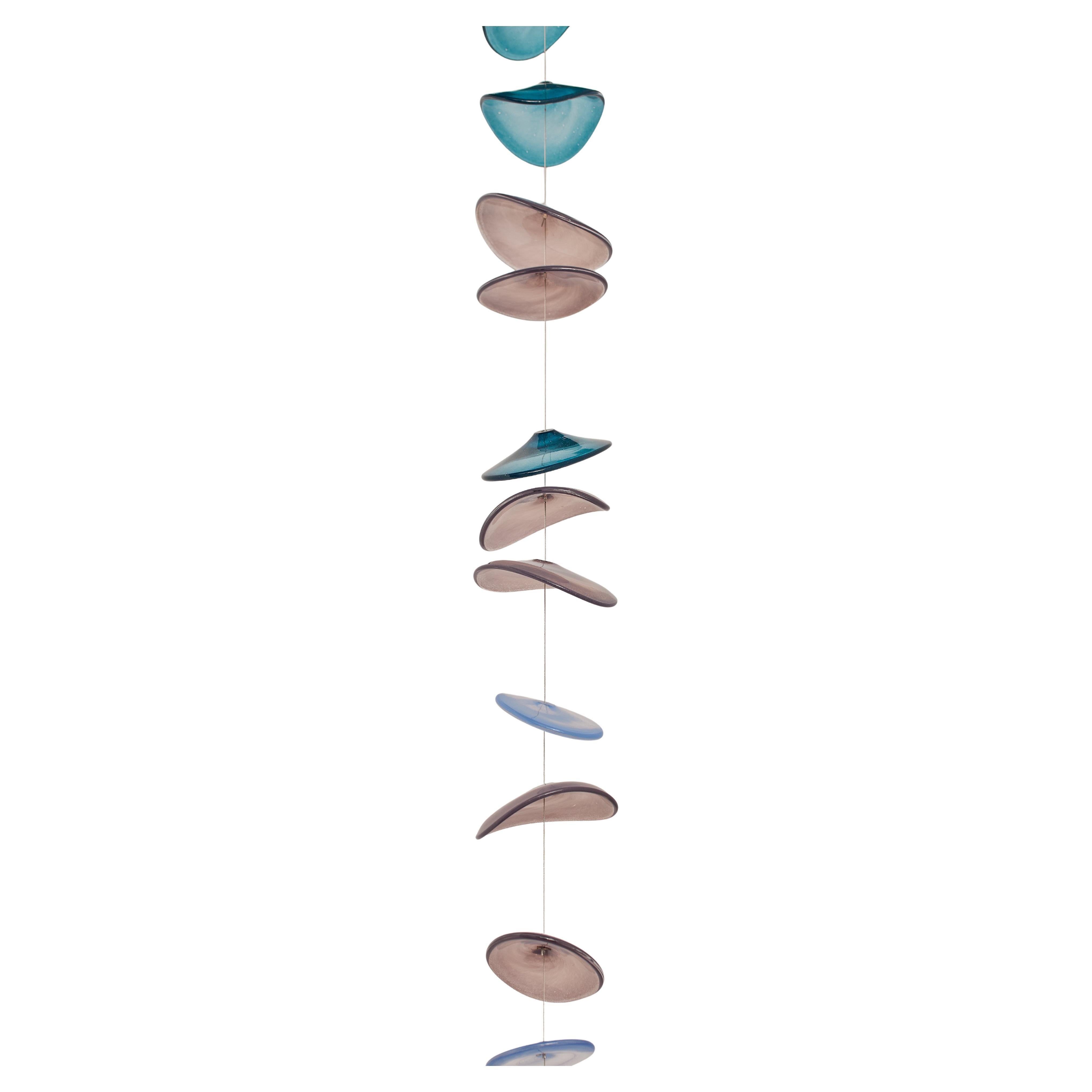 FLOATING SHADES. Mouth blown artisan glass discs. Custom made in Barcelona