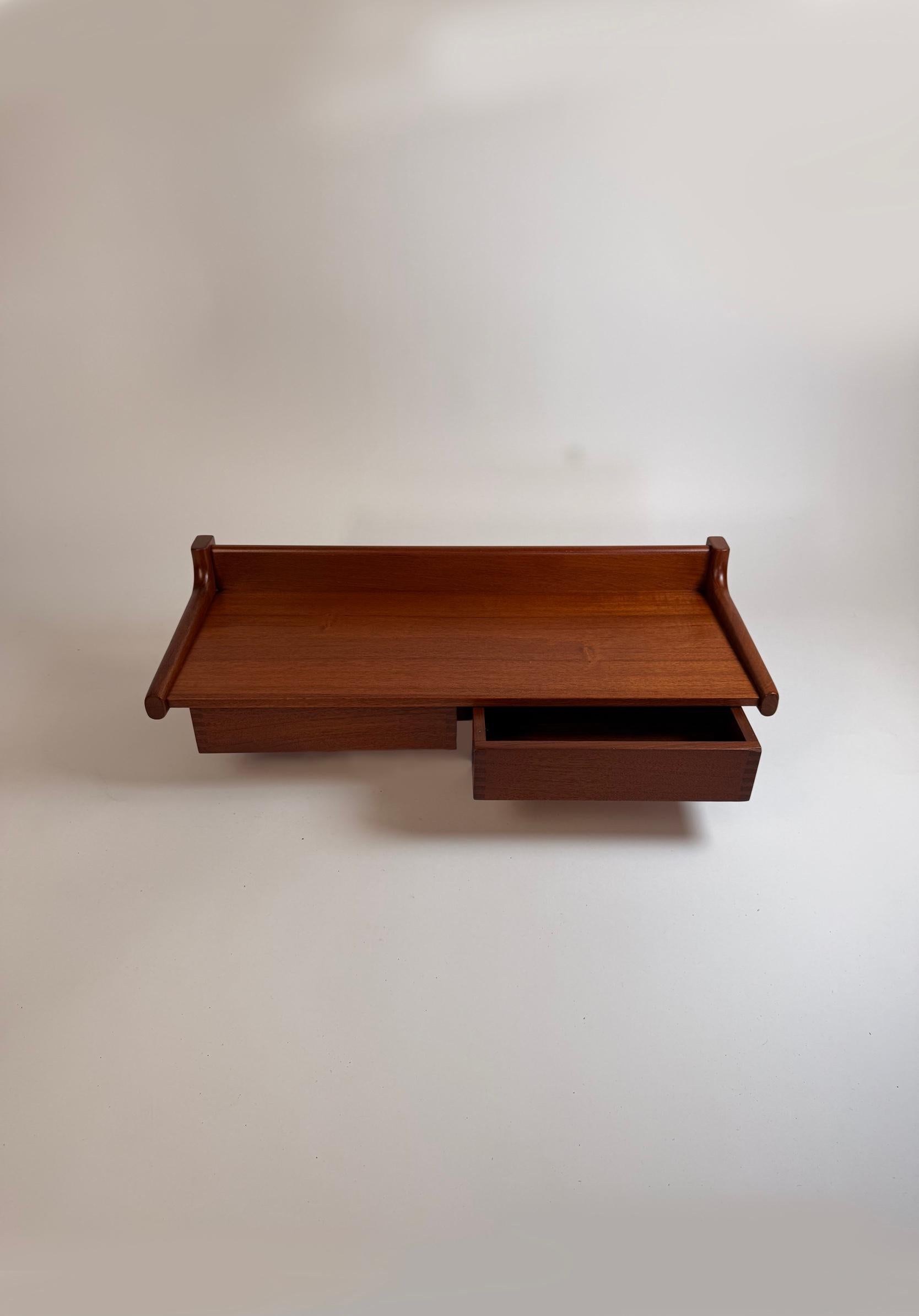 Floating Shelf by Børge Mogensen — Circa 1960s. A refined example of Mogensen’s understated Danish modern sensibility. Crafted in warm solid teak, the shelf appears to “float” on the wall, offering both functional storage and an elegant