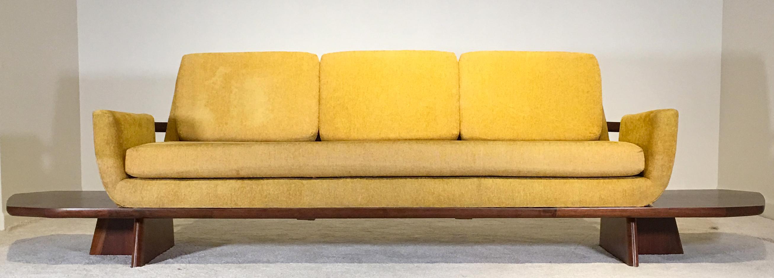 Samson Berman studio, NY, USA circa 1955 Measures: 123.75 wide x 30.25 deep and 34 inches tall. Priced to allow a client to reupholster the piece.

A one of kind 10 foot modernist floating platform sofa in walnut, with luxurious seating for 3 with