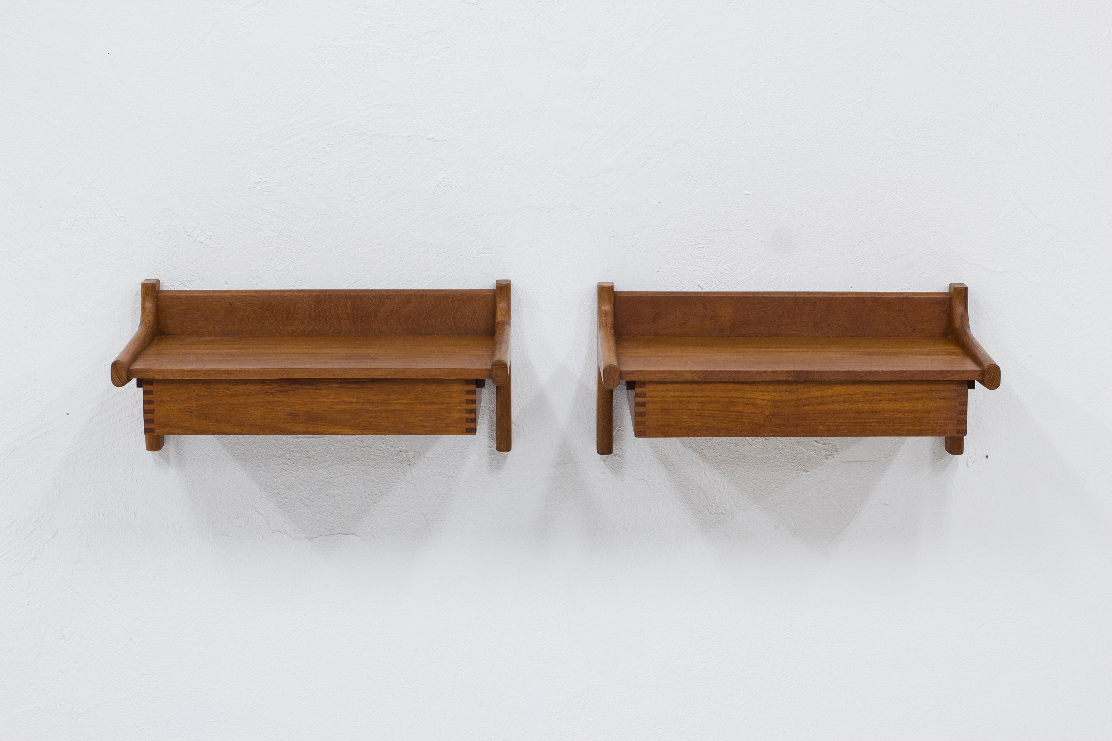 Pair of floating nightstands designed by Kai Kristiansen. Produced in Denmark by Kaagaards Møbelfabrik during the 1960s. Made mostly of solid teak with very nice details such as the zipper joinery in the shelves. Attaches to the wall with two