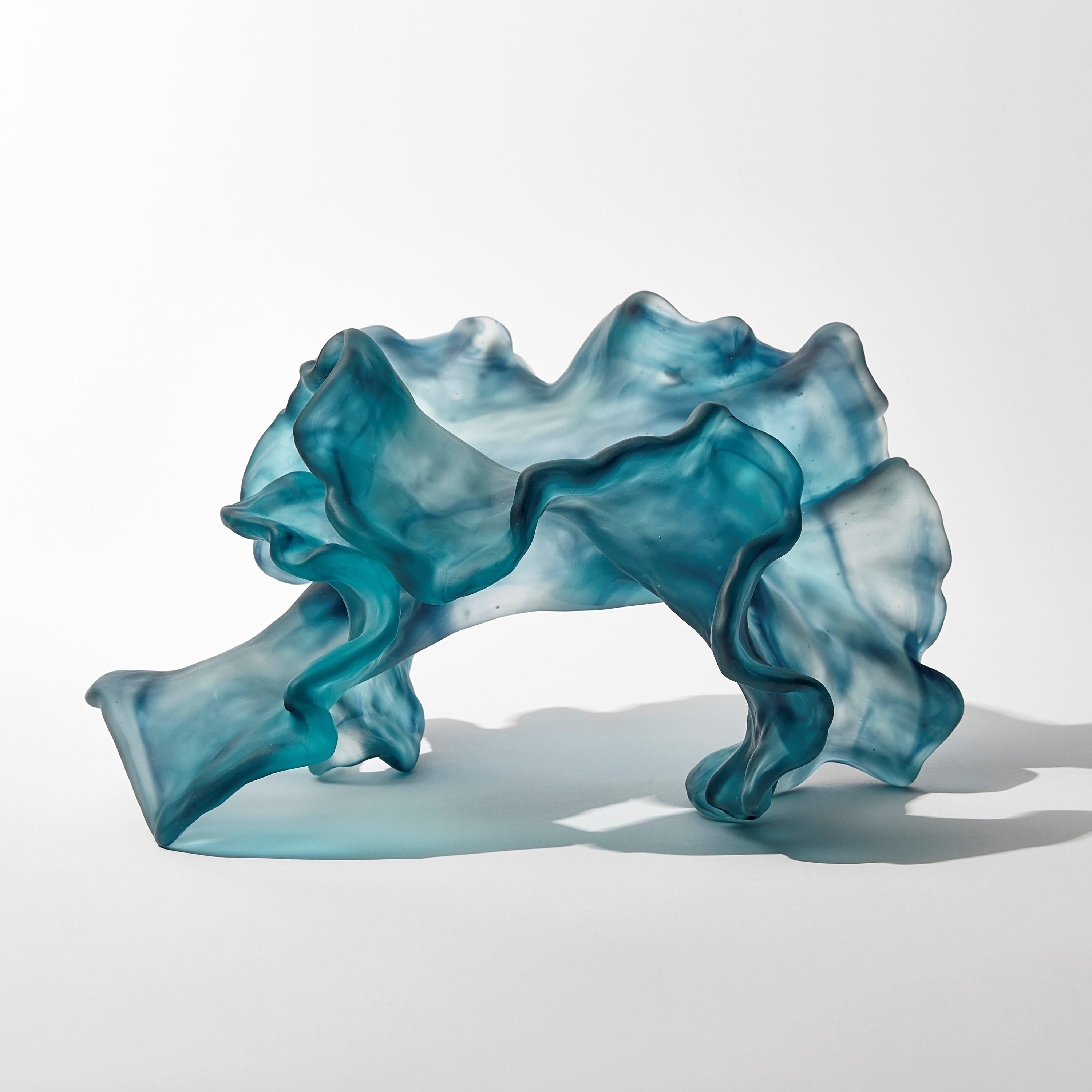 'Floating Twist' is a unique cast glass sculpture by the Danish artist, Monette Larsen.

Larsen has always been fascinated by the concept of beauty within nature; what makes something beautiful and the characteristics that define it as such. Her