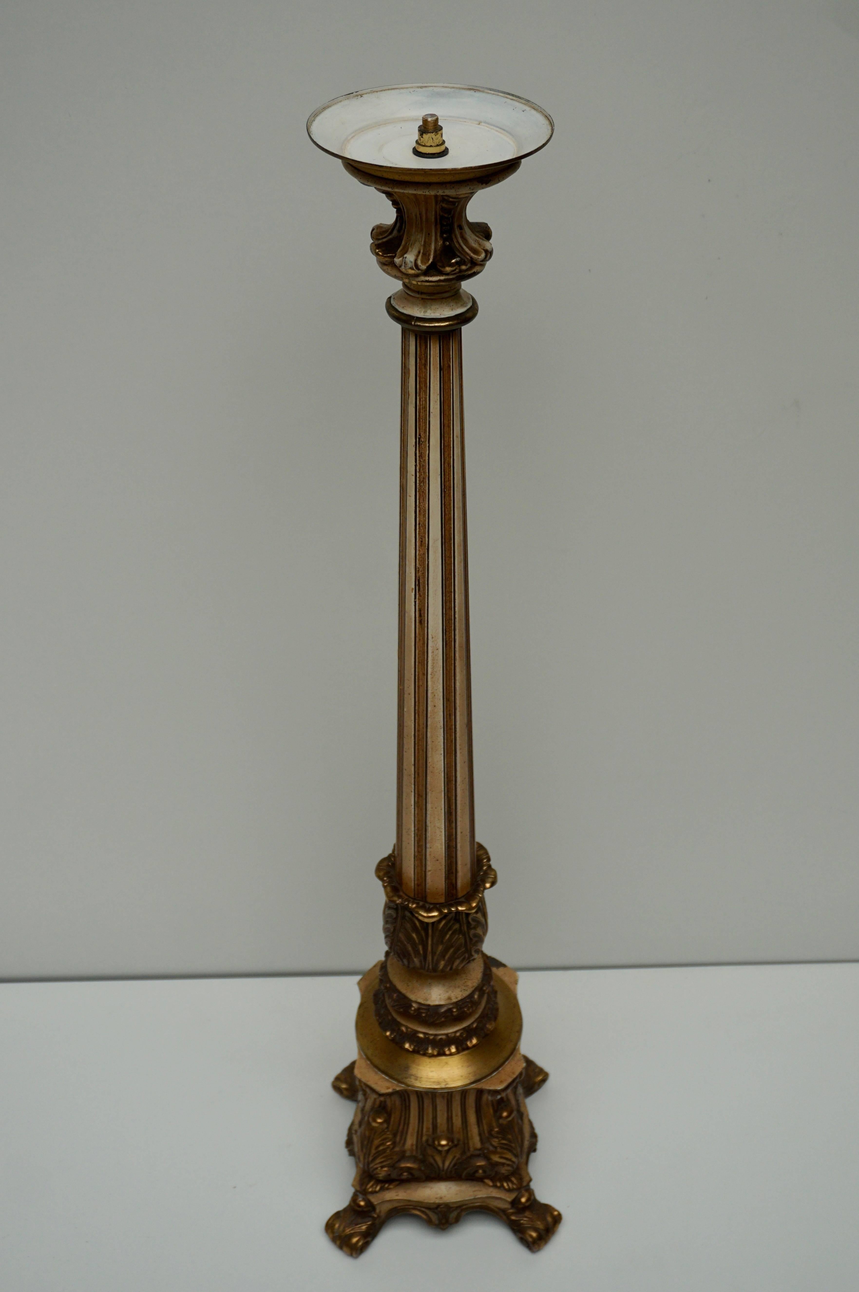 Brass and metal floor candelabra with ornaments.

