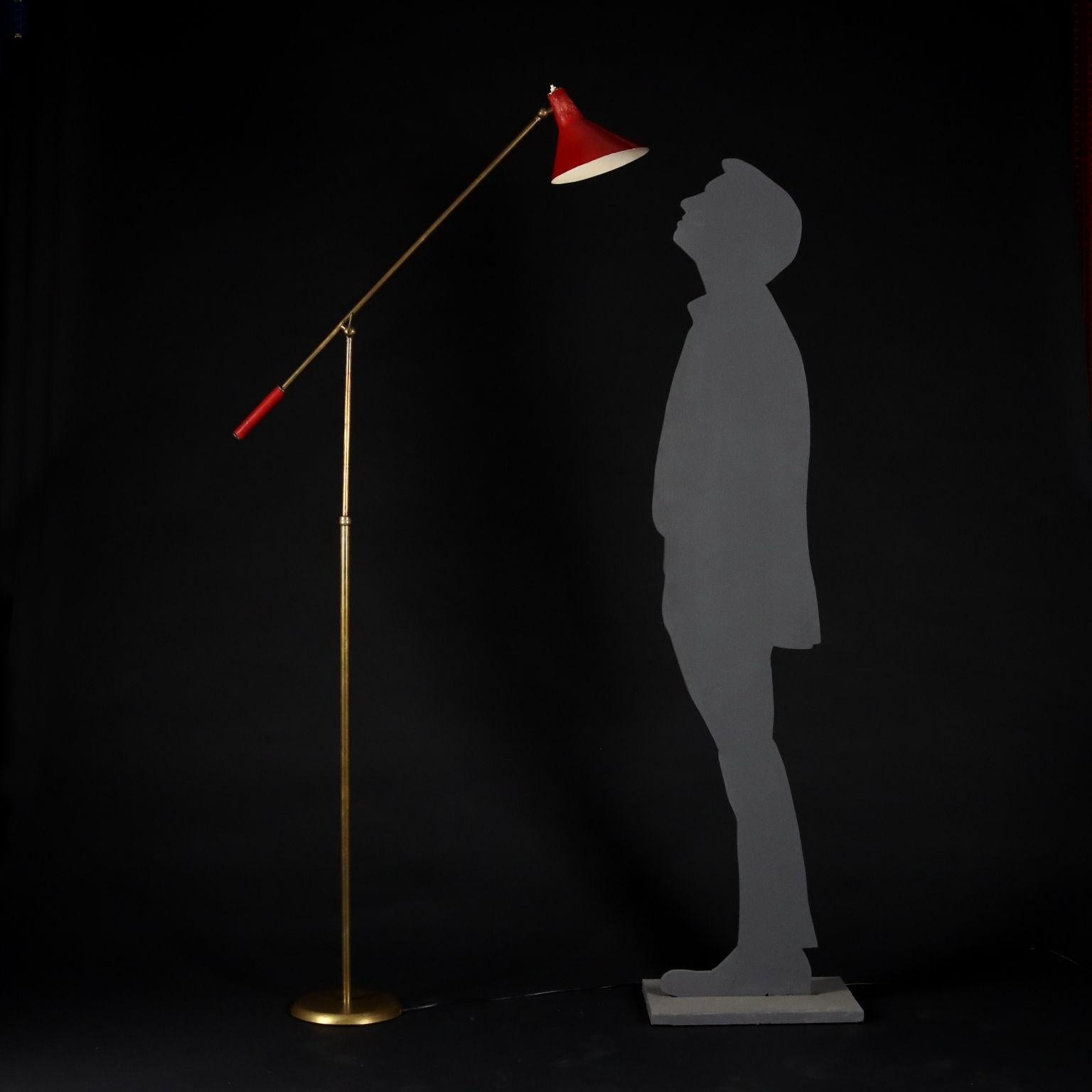 Floor lamp with adjustable inclination stick; brass, lacquered aluminum.