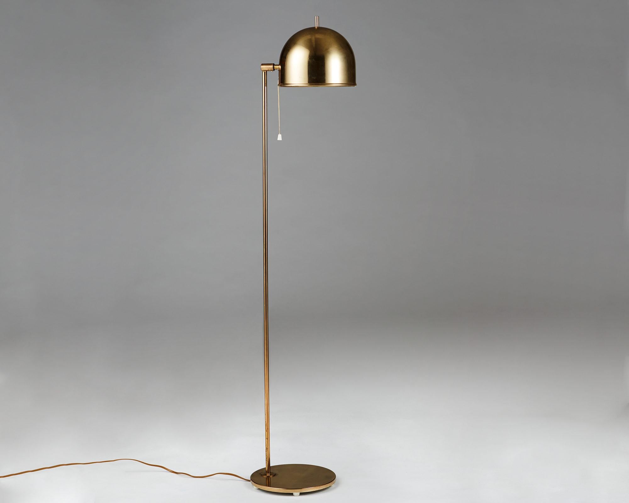 Brass. 

 Measures: H: 137 cm/ 4' 6'' 
Diameter of lampshade: 21 cm/ 8 1/4''.