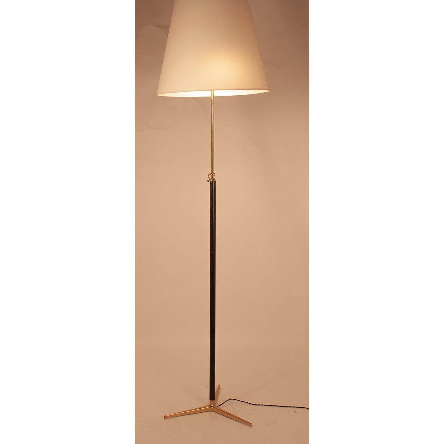 Floor lamp attributed to Gino Sarfatti with adjustable tubular polished brass stem wrapped in black leather. New fabric screen, 1950s.
Minimum height 172cm
Maximum height 220cm
European Plug (up to 250V). I have had a professional electrician