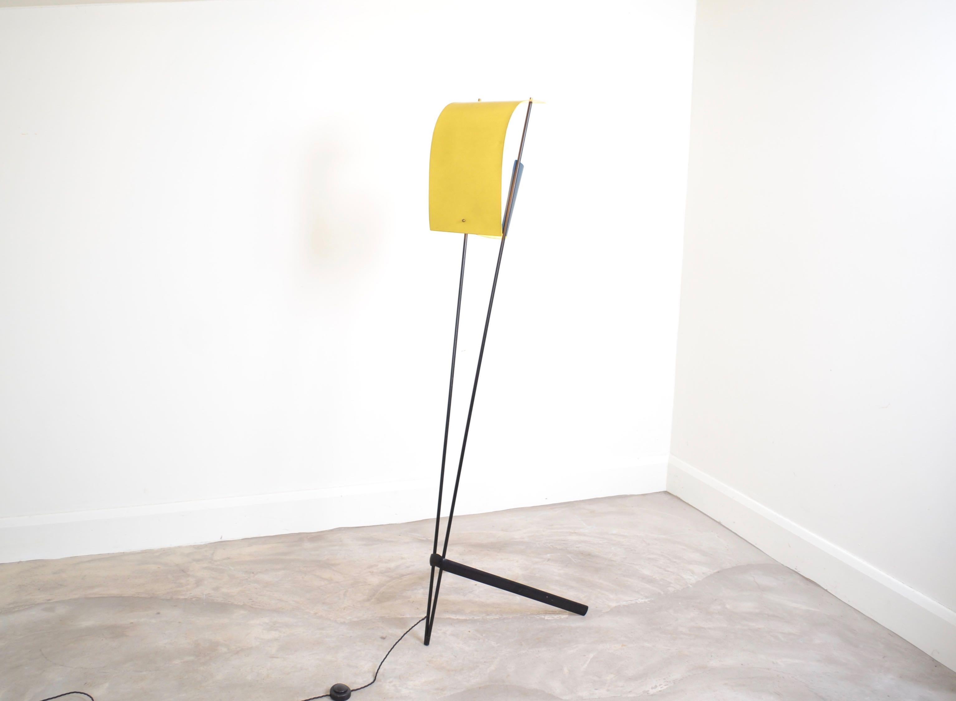 Floor lamp with original yellow and blue enamelled
shade and black painted iron base. The design is
very similar to the famous kite lamp designed by Pierre Guariche .This is an original and very decorative lamp from France, circa 1960.