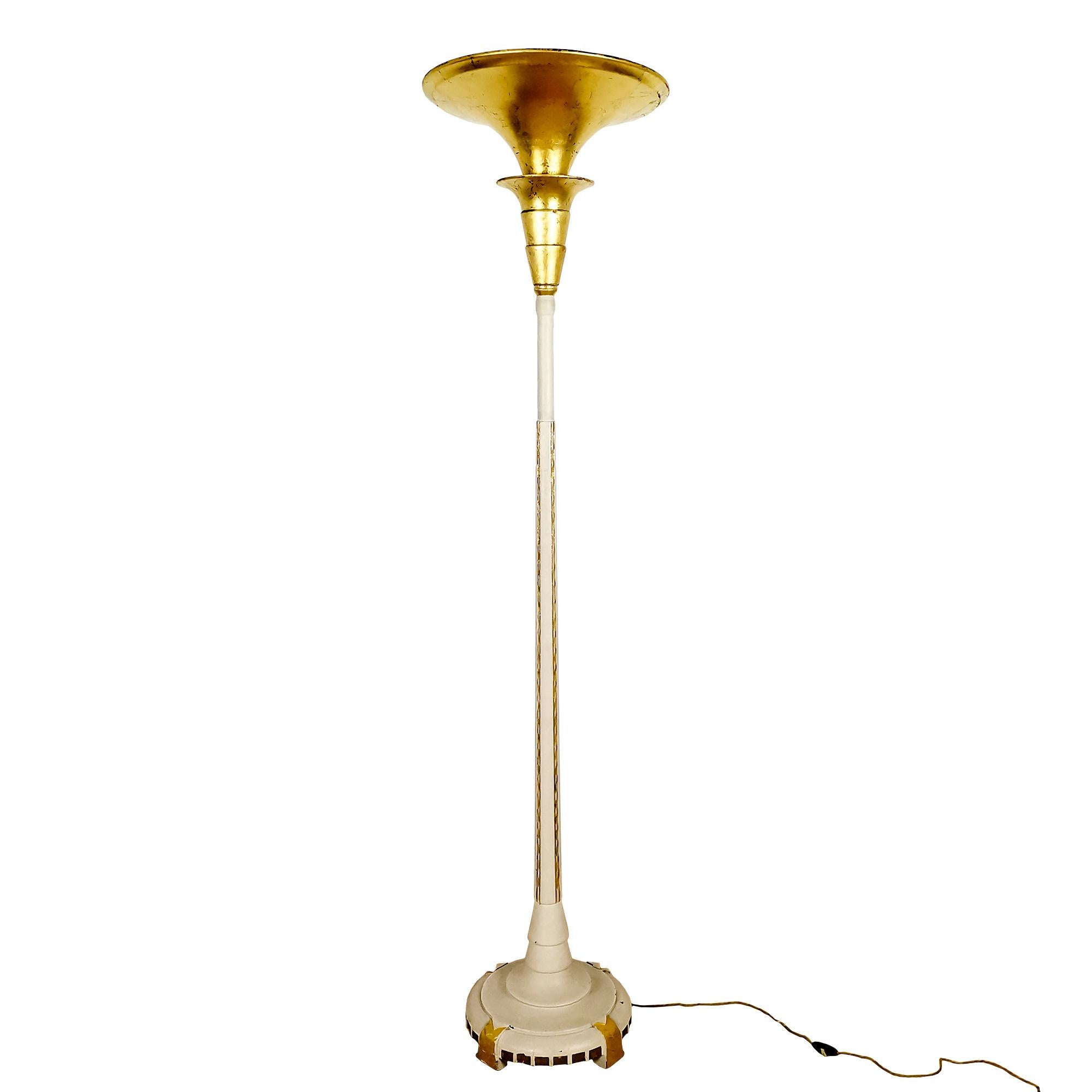 Floor lamp in turned and carved solid wood with ivory lacquered geometric patterns and golden details. Upper part in gold leaf. Indirect light.
Belgium c. 1925.

Dimensions:
cm Diam base 37 – top 43 x heigh 185
inches Diam base 14.56 – top 16.92 x