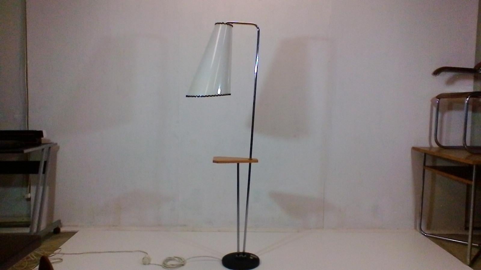 The item is made in Društvo Lidokov in Czechoslovakia. The lamp is made for metal chromed frame, metal painted base, wooden painted side table and mica shade. Functional status and good condition.