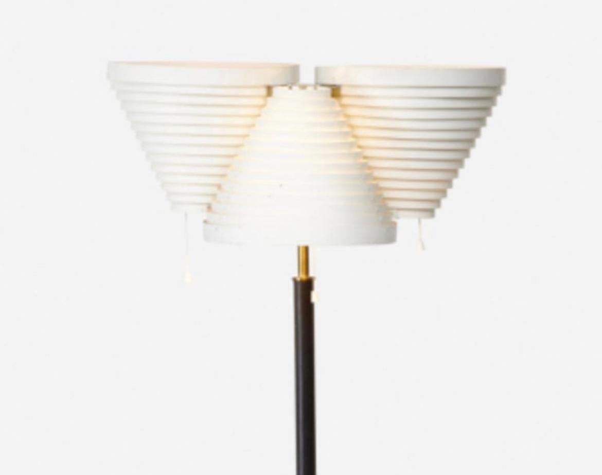 Beautiful Alvar Aalto standard floor lamp, model A809, Artek. Finland, 1959. Enameled steel, brass, and leather.
Provenance: Private Collection
Literature: Alvar Aalto: Designer, Lahti, pg. 107 Alvar & Aino Aalto Design: Collection Bischofberger,